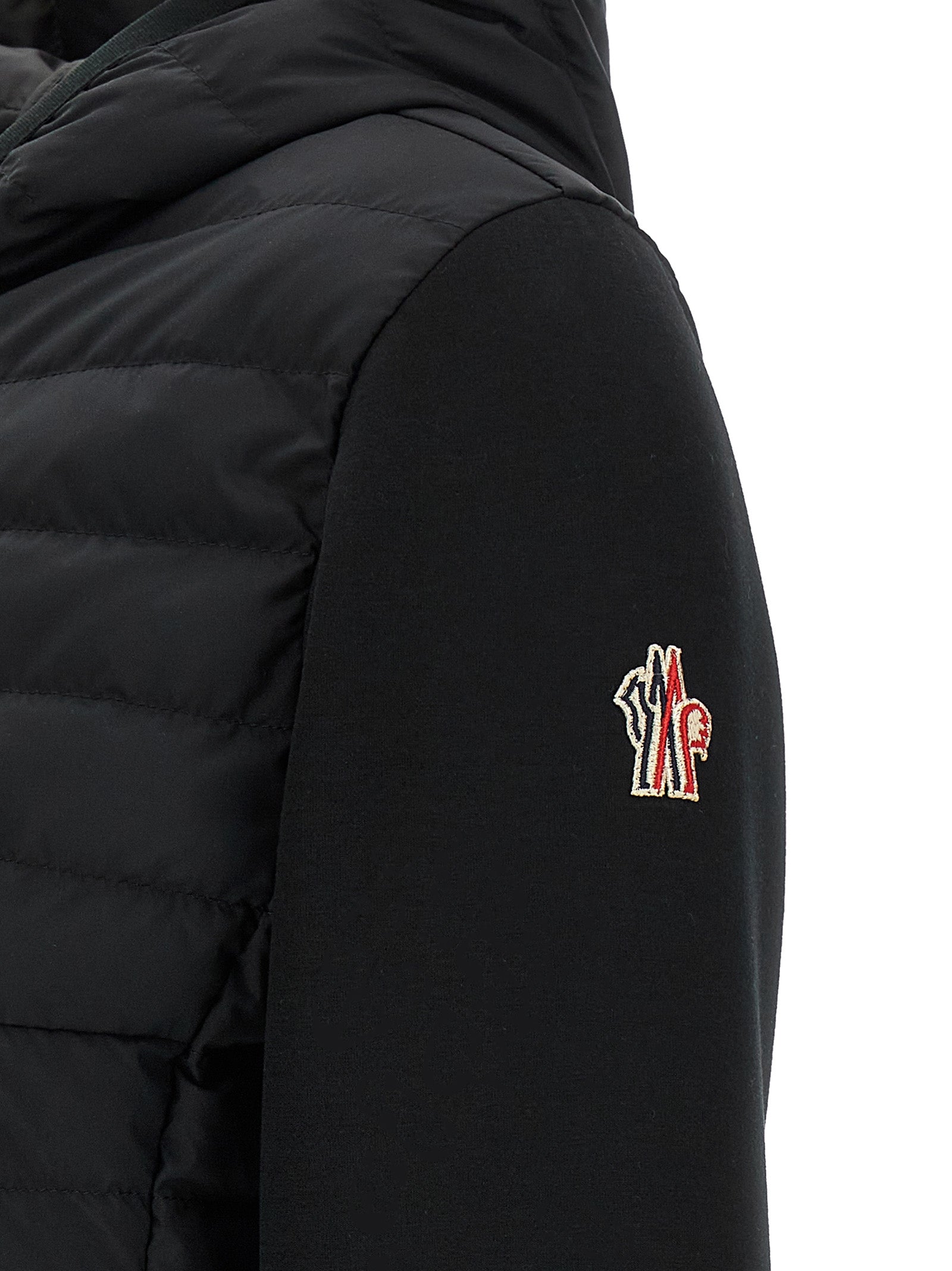 Elevate your style with the Moncler Grenoble Black Polyamide Full-Length Jacket, a masterpiece of goose down craftsmanship, blending luxury and sophistication for the discerning individual.