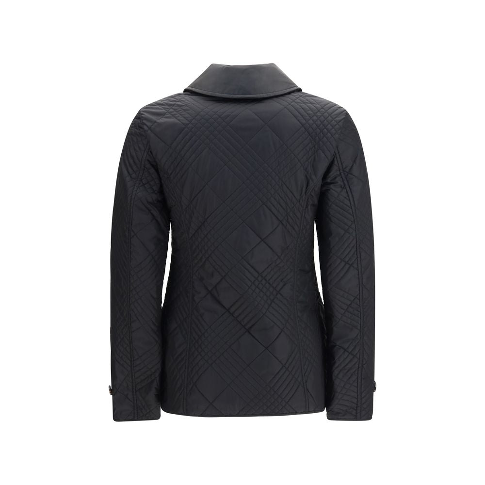 Experience the epitome of luxury with the Burberry Black Polyamide Full-Length Jacket, a masterpiece of craftsmanship and timeless elegance for discerning individuals.