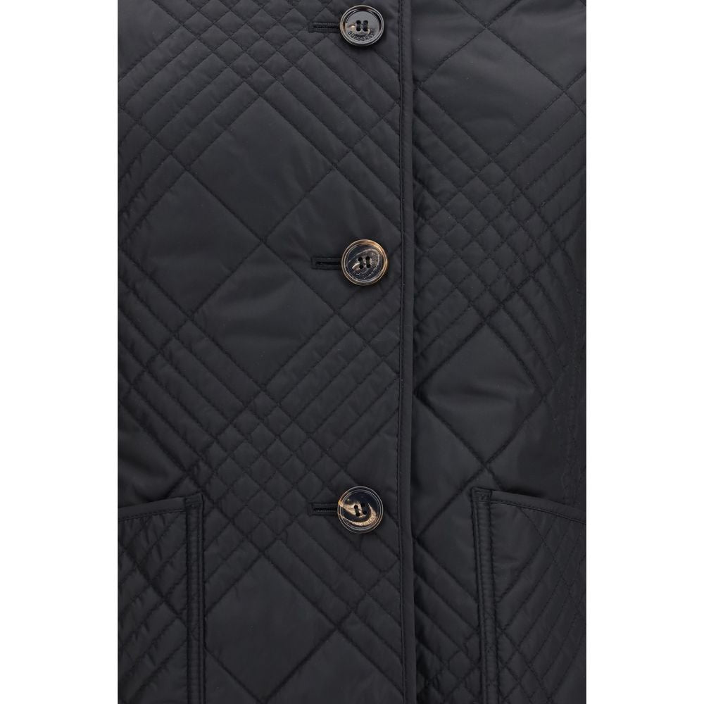 Experience the allure of the Burberry Black Polyamide Full-Length Jacket, a masterpiece of lightweight nylon and signature Micro Check quilting, redefining luxury elegance for the discerning individual.