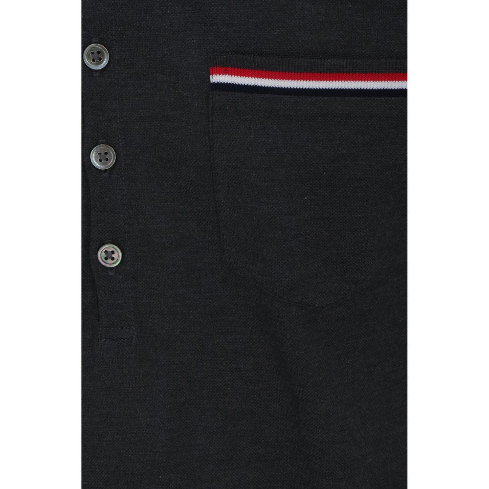 Indulge in the timeless elegance of the Thom Browne Gray Cotton Polo Shirt, crafted from 100% cotton for unparalleled luxury and style, perfect for the discerning individual.
