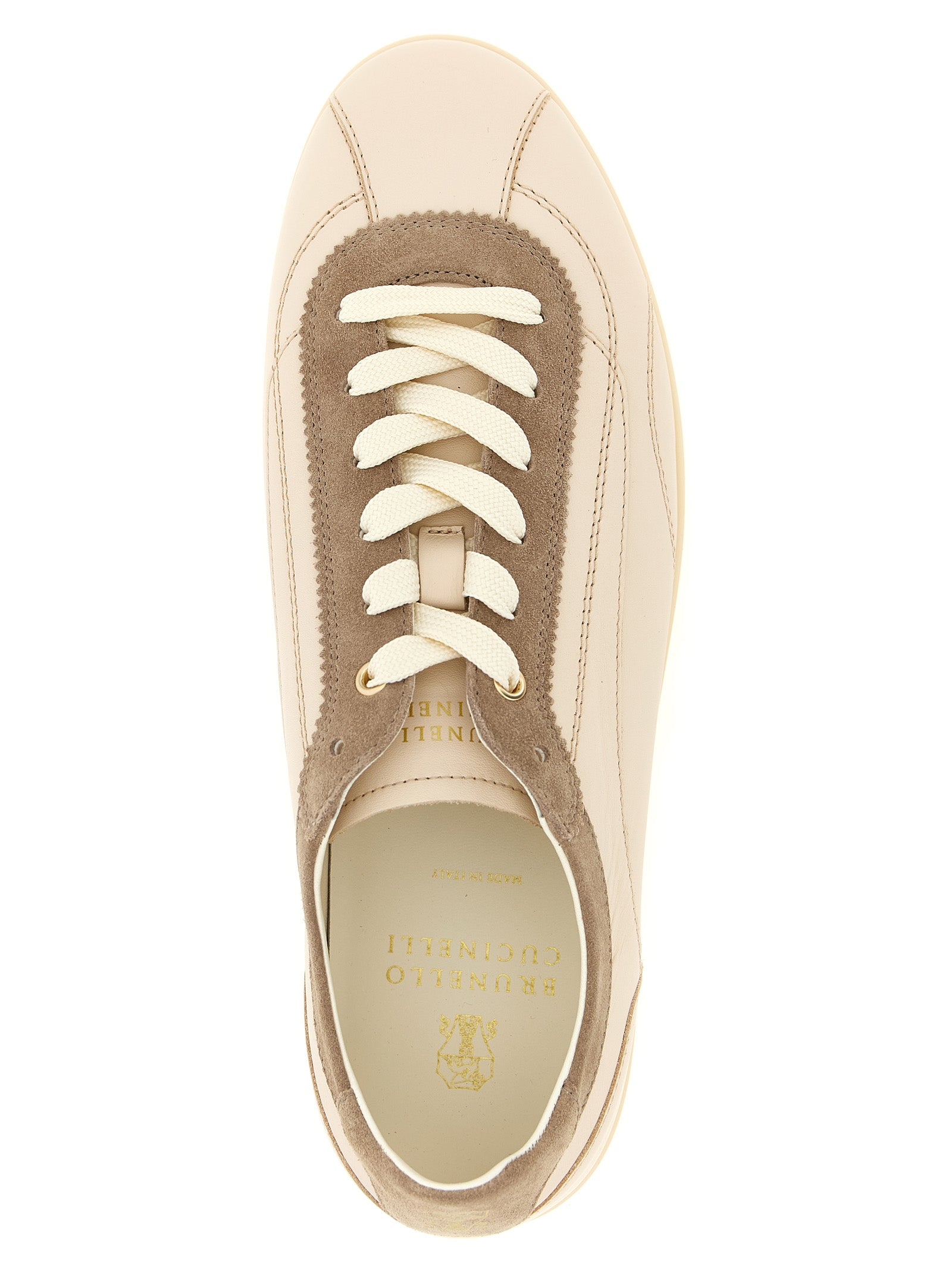 Discover Brunello Cucinelli's Beige Calfskin Low Top Sneakers, where exquisite craftsmanship meets timeless elegance, perfect for the discerning individual seeking luxury.