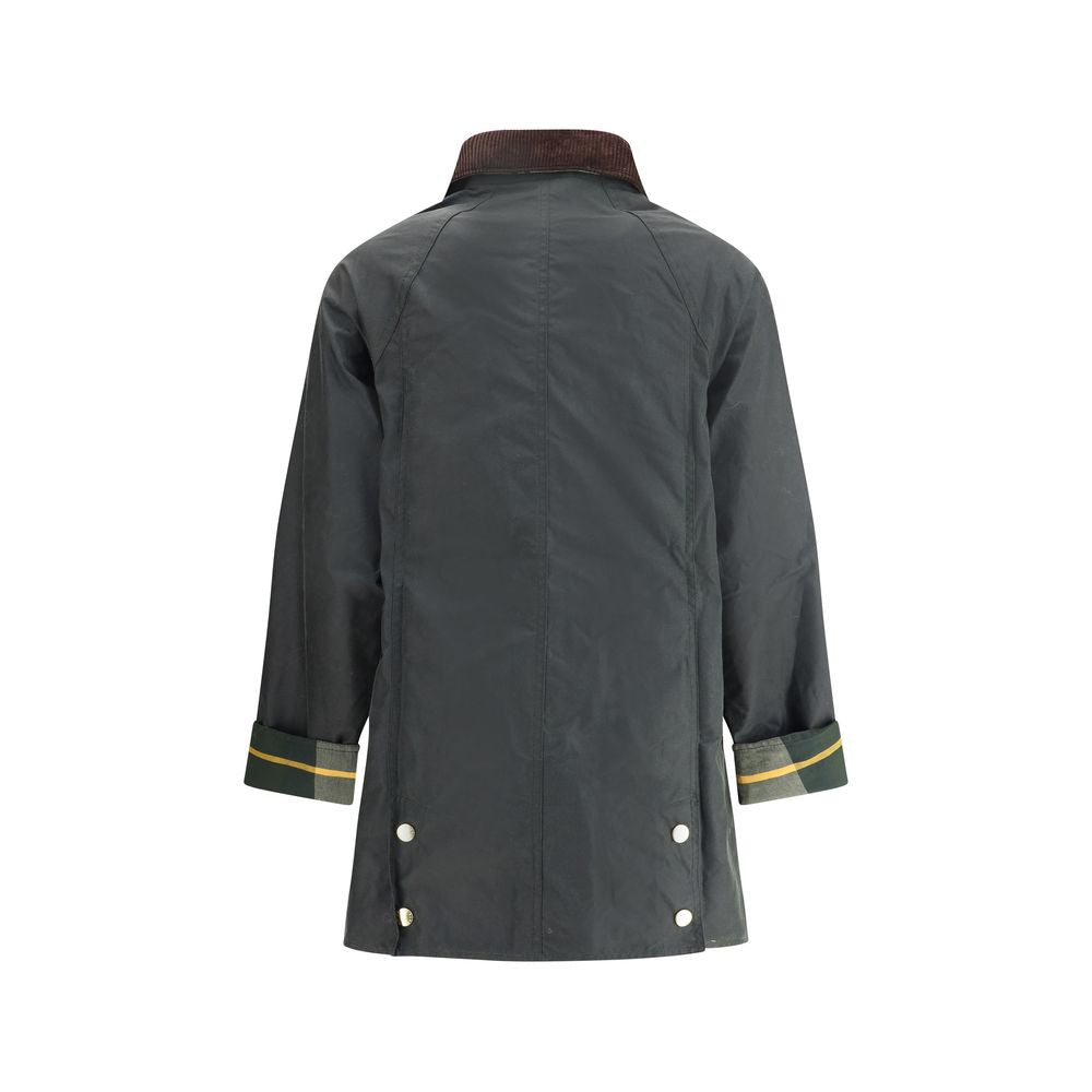 Elevate your wardrobe with the Barbour Bicolor Cotton Coat, a luxurious blend of tradition and modernity, crafted from 100% cotton for timeless sophistication.