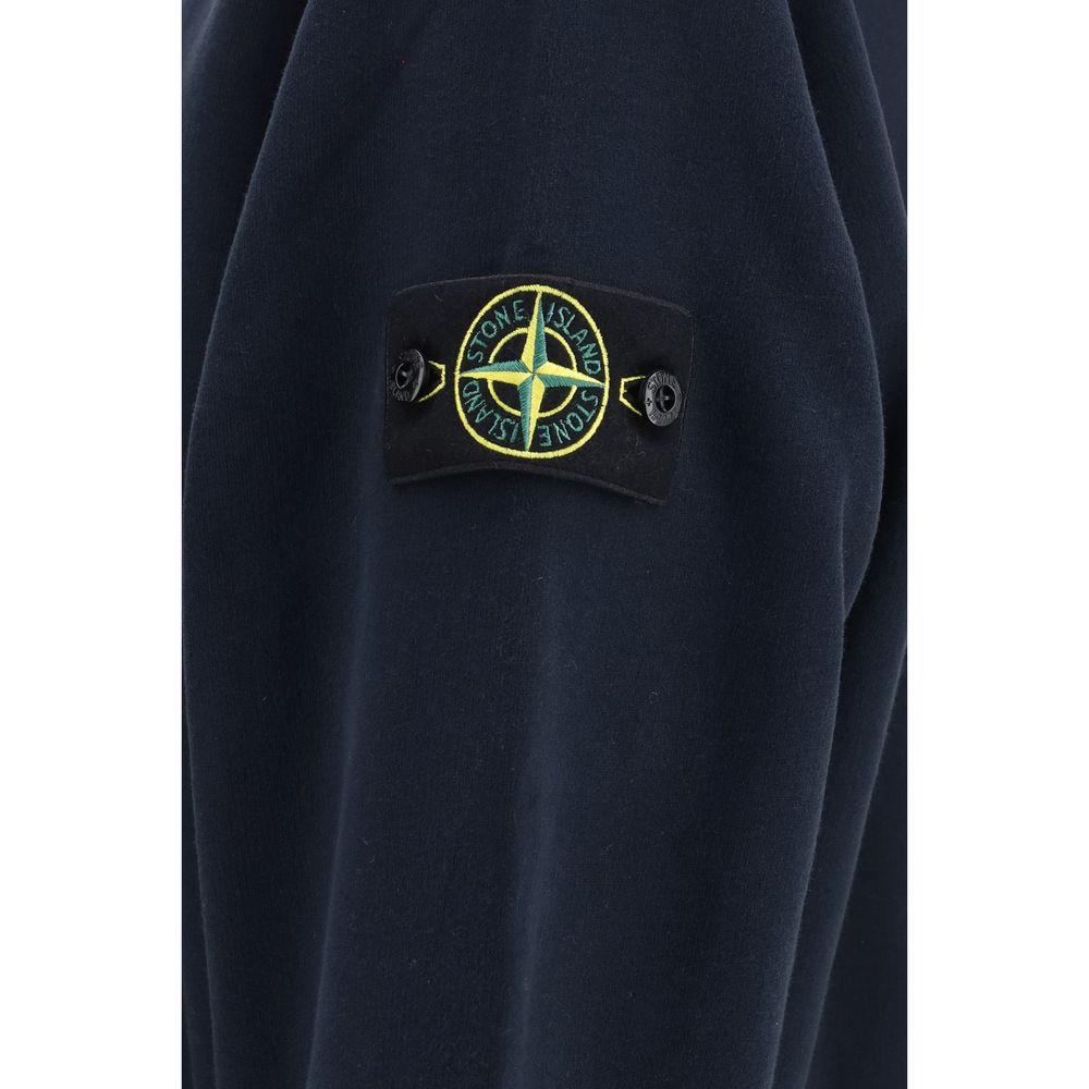 Indulge in the Stone Island Blue Cotton Sweatshirt, where luxurious cotton meets sophisticated design, offering unparalleled comfort and timeless elegance for discerning tastes.