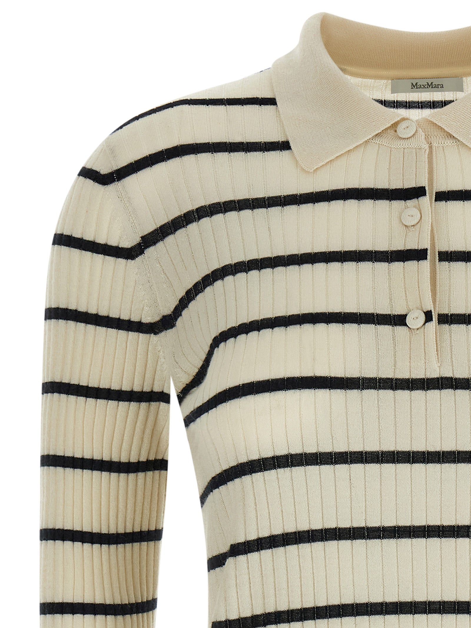 Experience the allure of the Max Mara Blue Cashmere Polo Shirt, a luxurious blend of cashmere and silk, redefining elegance for the discerning individual.