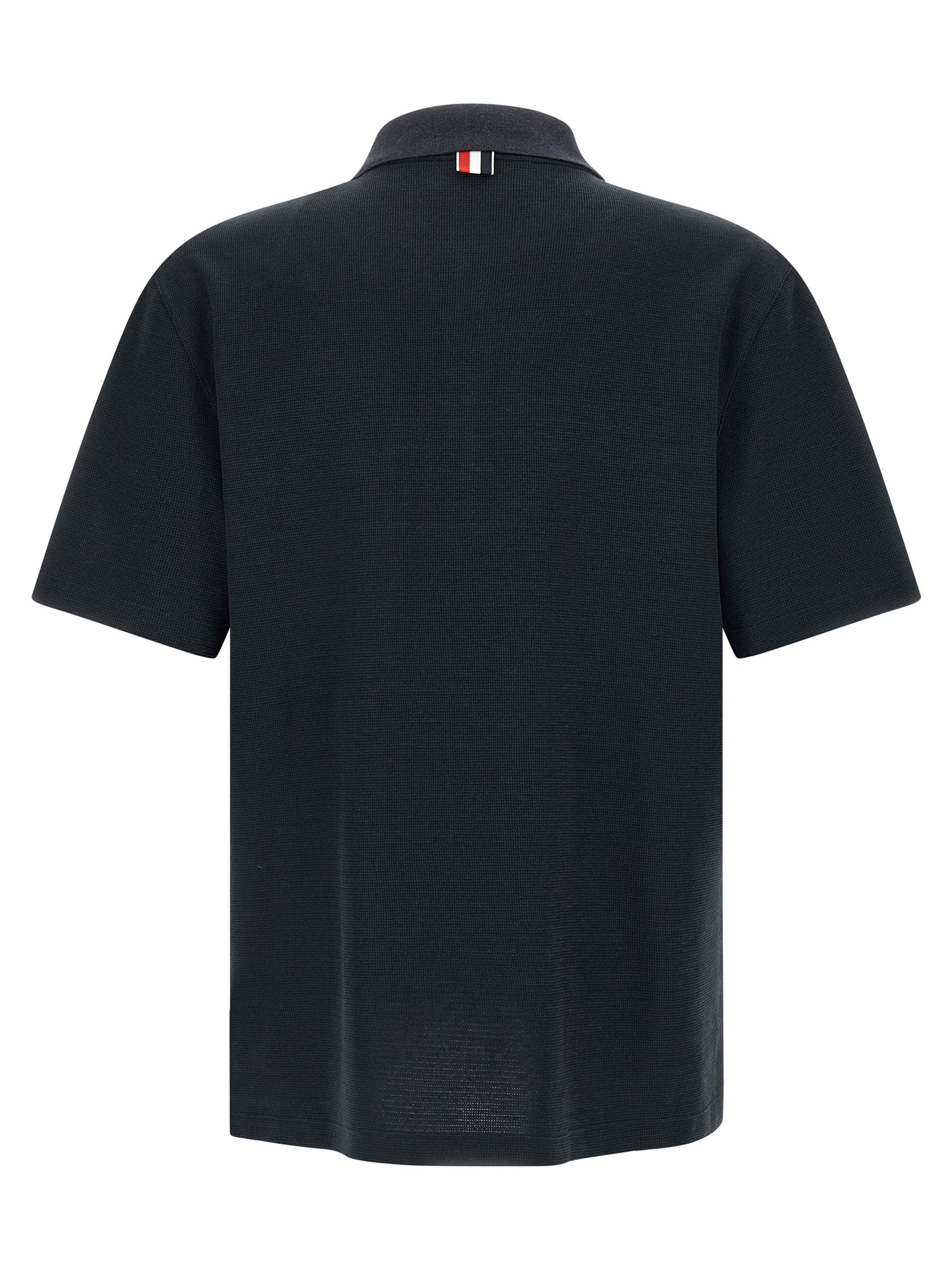 Indulge in the exquisite Thom Browne Blue Cotton Polo Shirt, a masterpiece of Italian craftsmanship, blending luxurious materials for timeless sophistication and style.