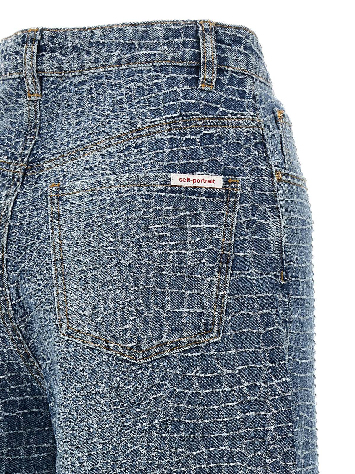 Elevate your wardrobe with Self-Portrait's Blue Cotton Jeans, featuring a crocodile weave print and crystal appliqué, embodying luxury and sophistication for the discerning individual.