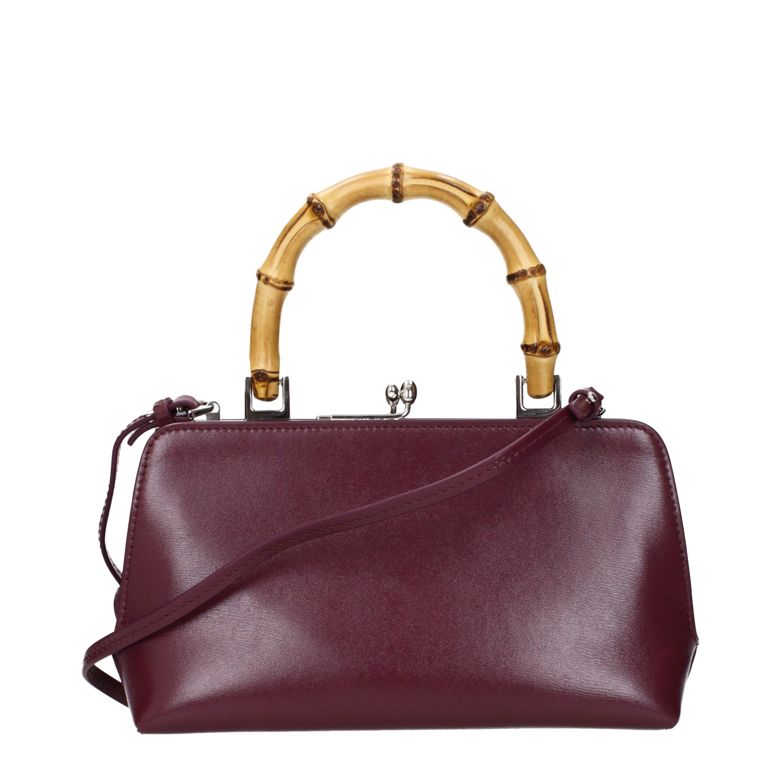 Discover the Jil Sander Red Leather Handbag, a symbol of opulence and sophistication, crafted for those who appreciate exquisite design and timeless elegance.