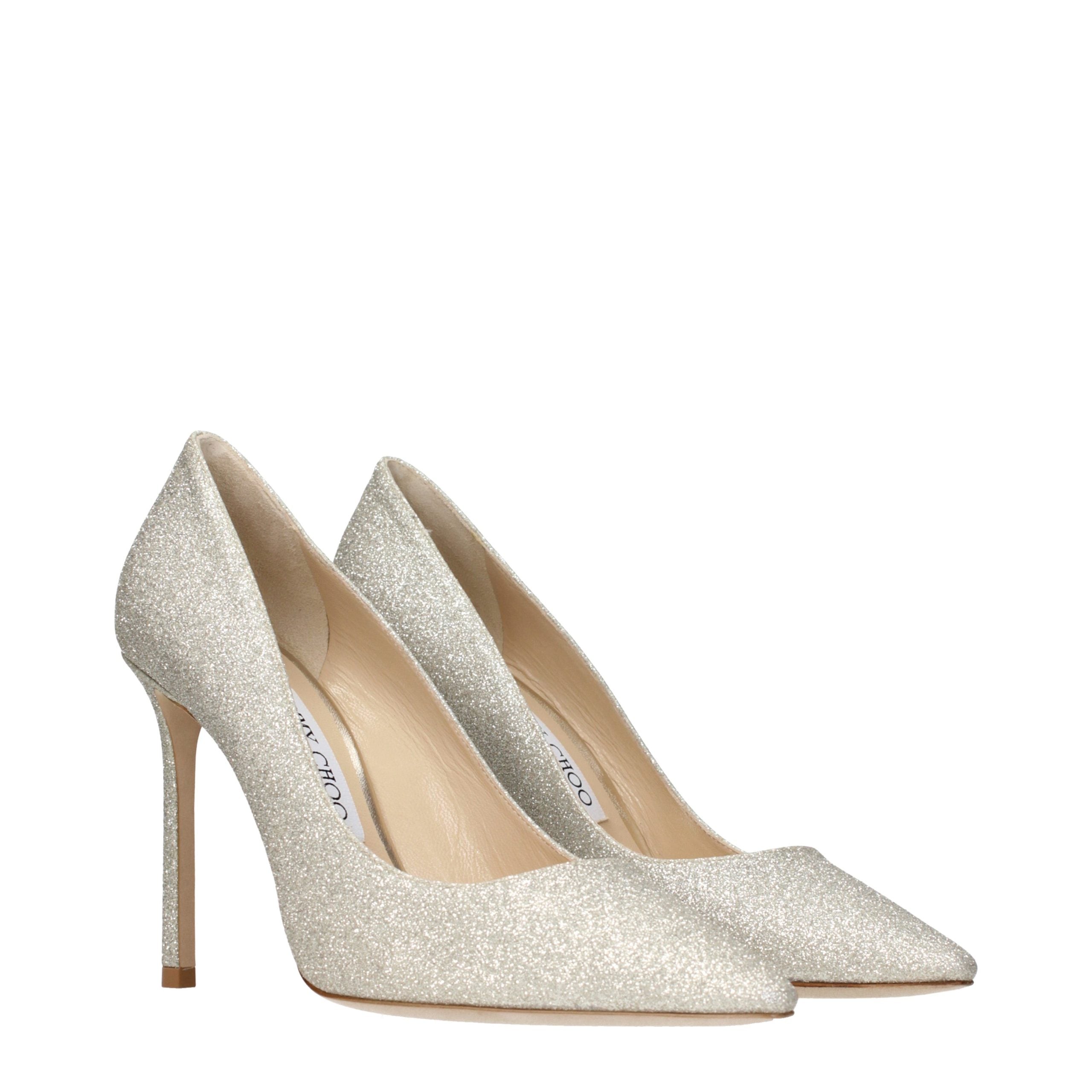 Experience the allure of Jimmy Choo Gold High Heel Pumps, where exquisite craftsmanship meets luxurious elegance, perfect for those who command attention and embody sophistication.