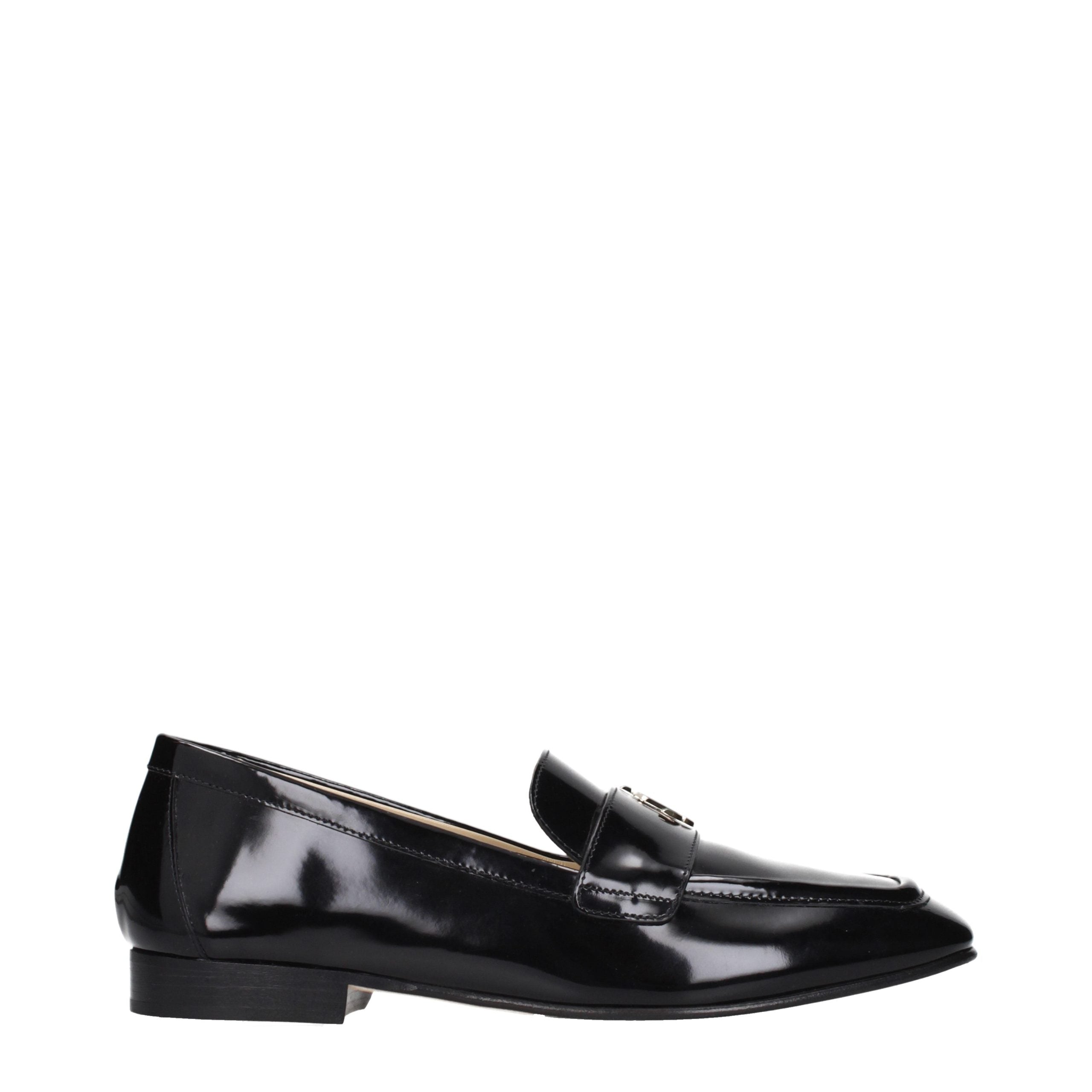 Elevate your style with Jimmy Choo Black Leather Slip-On Loafers, where exquisite craftsmanship meets timeless luxury, perfect for the discerning individual.