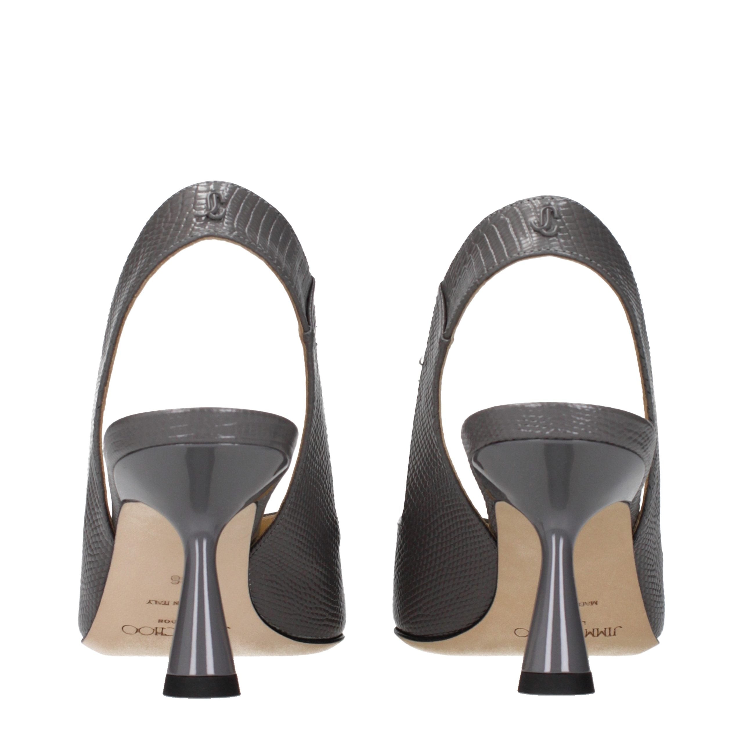 Experience the allure of Jimmy Choo Gray Leather High Heel Pumps, where exquisite craftsmanship meets timeless elegance, elevating your every moment with luxurious sophistication.
