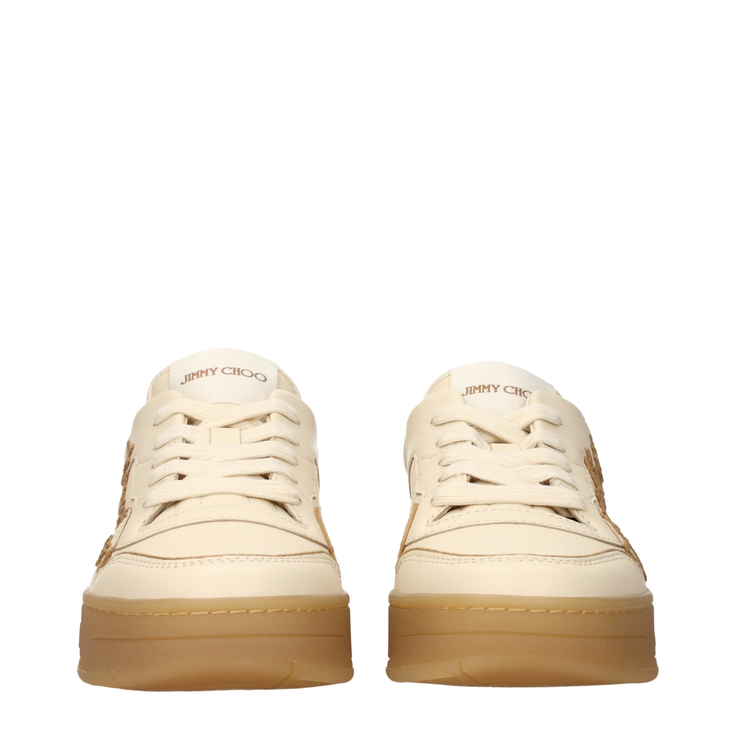 Experience the exquisite allure of Jimmy Choo Beige Leather Low Top Sneakers, where luxurious craftsmanship meets effortless elegance, perfect for the discerning fashion connoisseur.