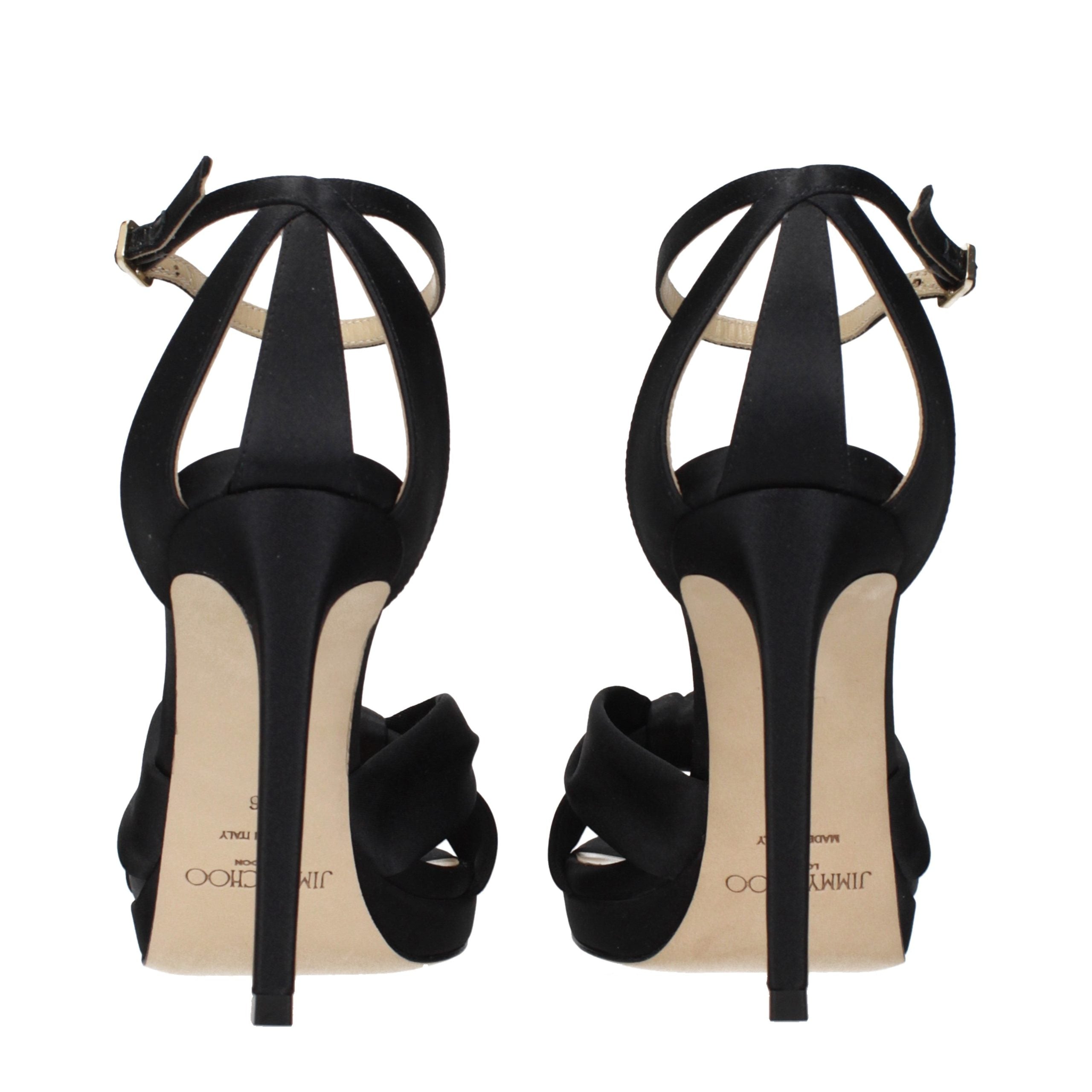 Step into elegance with Jimmy Choo Black Satin Platform Sandals, where exquisite craftsmanship meets luxurious allure, perfect for the discerning fashion connoisseur.