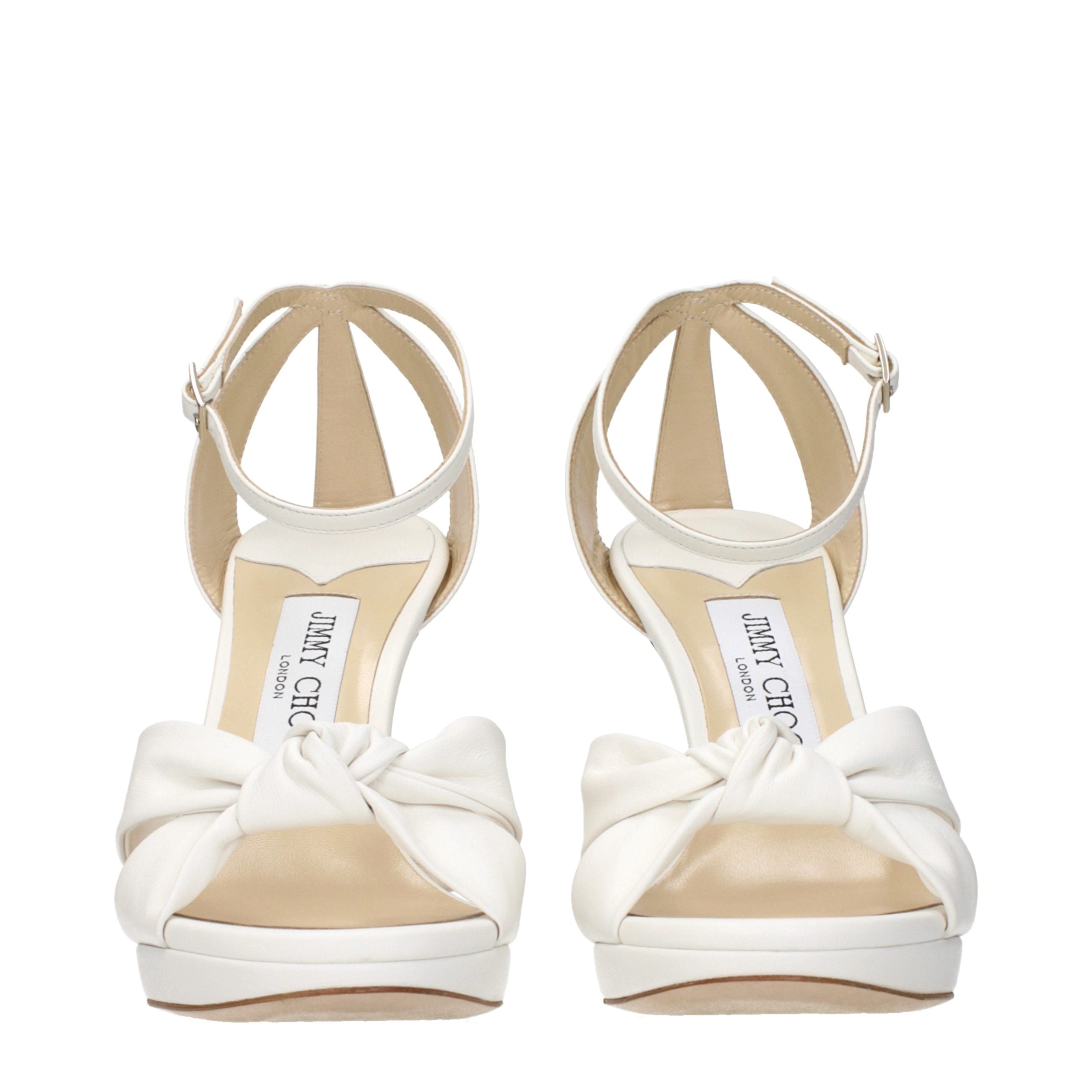 Elevate your style with Jimmy Choo White Leather Platform Sandals, where exquisite craftsmanship meets timeless elegance, perfect for the discerning fashionista.