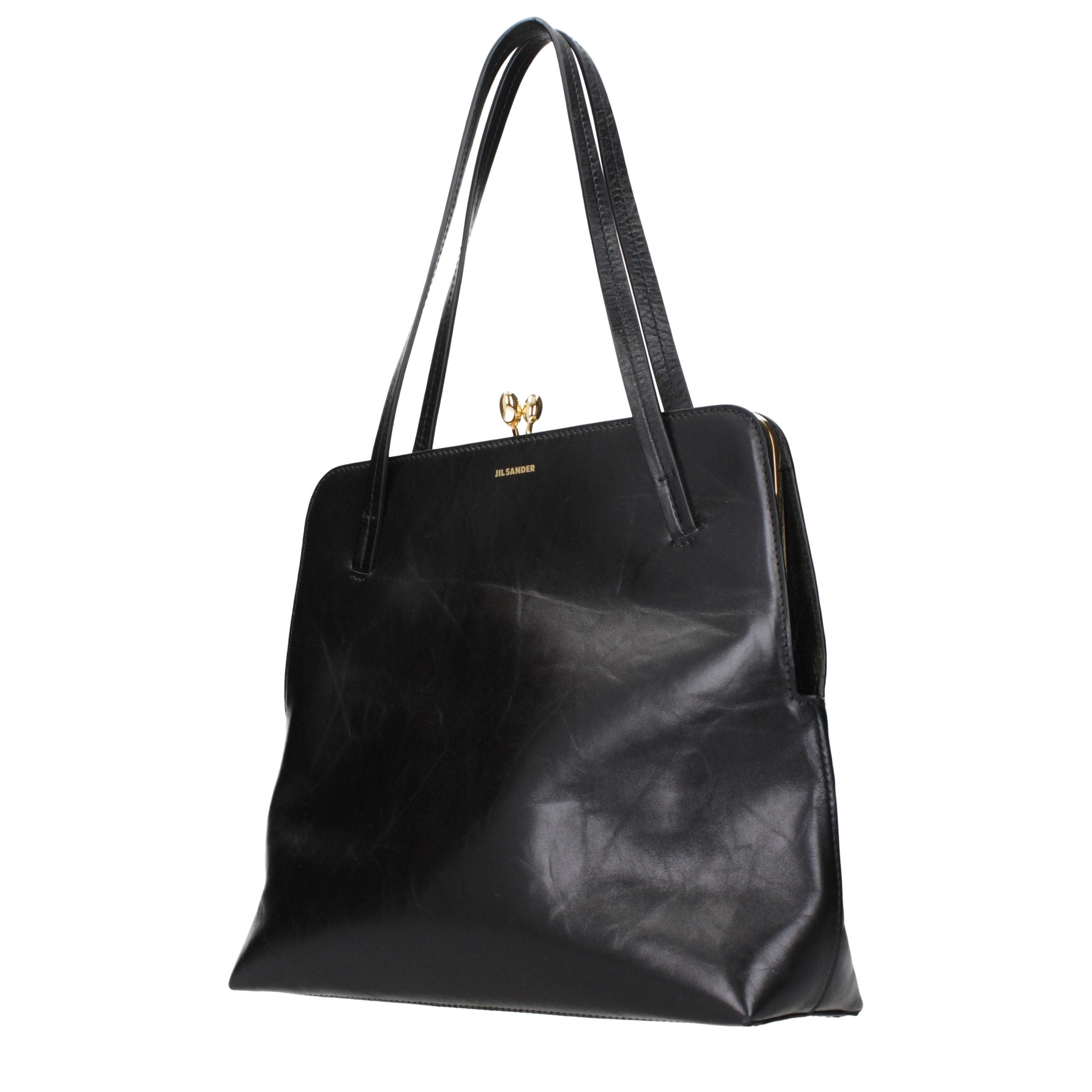 Indulge in the exquisite allure of the Jil Sander Black Leather Shoulder Bag, a timeless luxury accessory that embodies sophisticated craftsmanship and refined elegance.