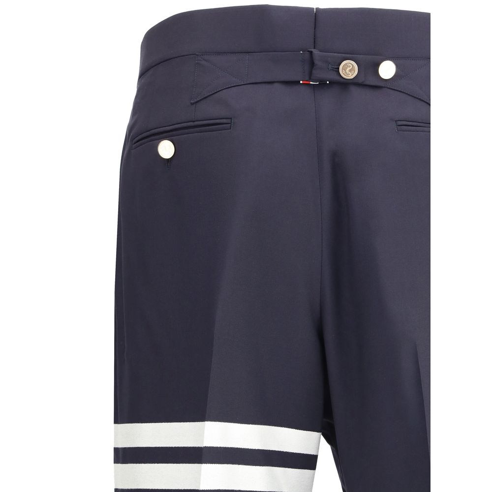 Experience the exquisite craftsmanship of Thom Browne's Blue Wool Oves Aries Pants, a luxurious blend of comfort and sophistication for the discerning individual.
