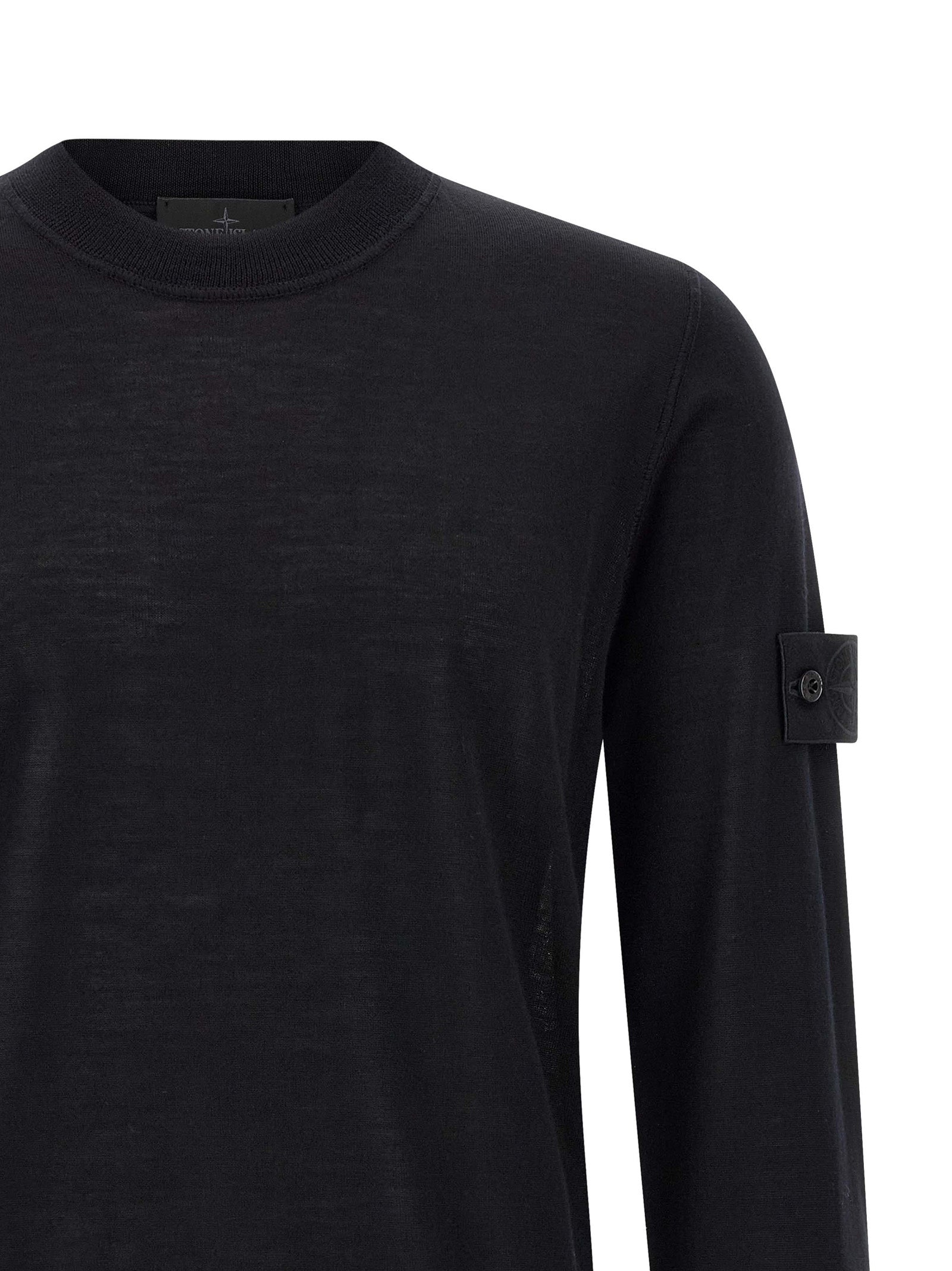 Indulge in the Stone Island Black Virgin Wool Cardigan, a masterpiece of fine craftsmanship and timeless elegance, perfect for those who embody sophistication and style.