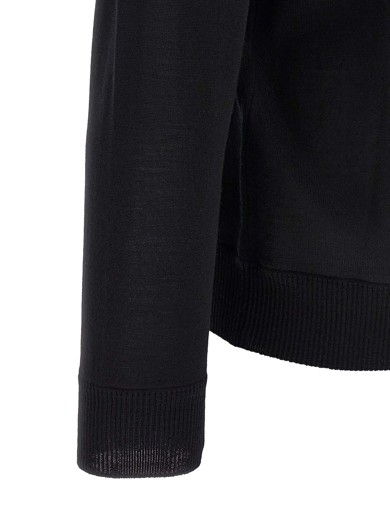 Discover the Stone Island Black Virgin Wool Cardigan, a masterpiece of fine knit craftsmanship that embodies timeless elegance and sophisticated allure for every occasion.