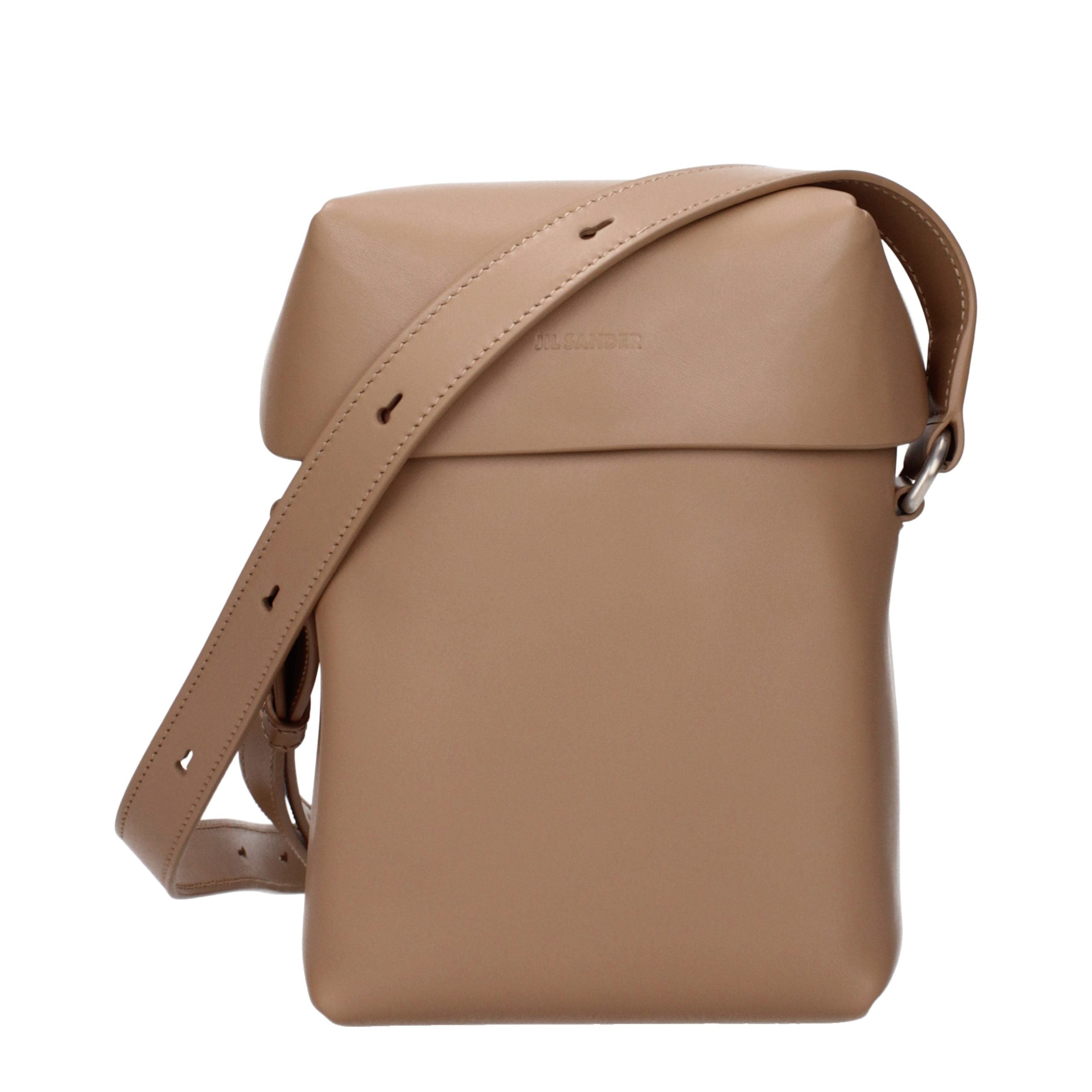 Discover the Jil Sander Brown Leather Crossbody Bag, a minimalist masterpiece that embodies timeless elegance and refined craftsmanship for the discerning individual.