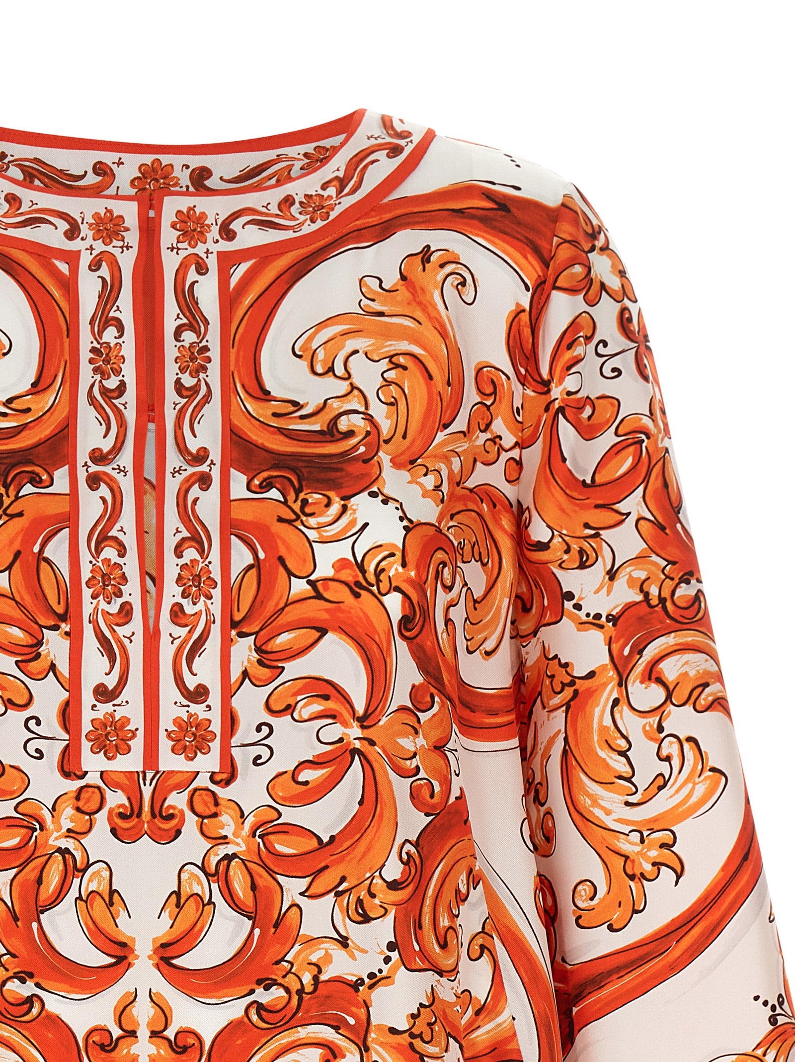 Indulge in the exquisite Dolce & Gabbana Orange Silk Short Dress, a luxurious embodiment of elegance and bold design, perfect for the discerning fashionista.