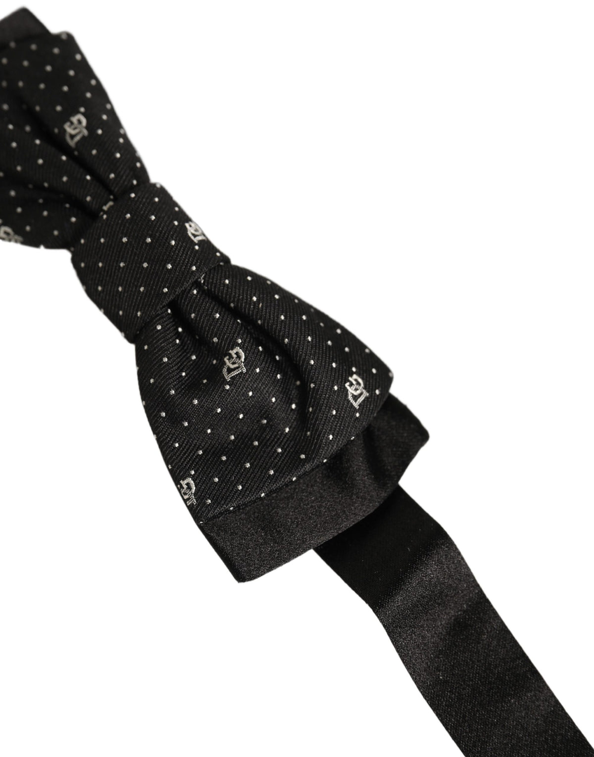 Elevate your style with the Dolce & Gabbana Black DG Polka Dot Bow Tie, a luxurious silk accessory that embodies sophistication and exquisite Italian craftsmanship.
