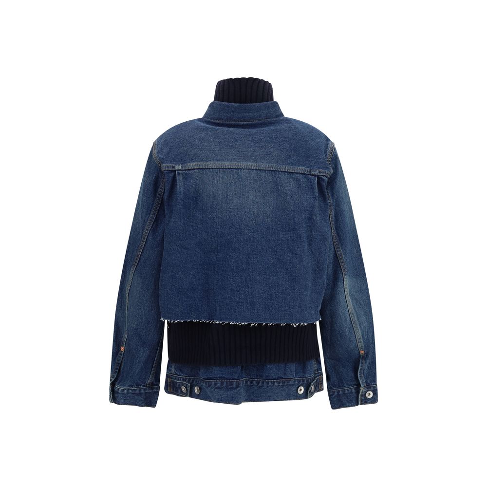 Elevate your wardrobe with the Sacai Blue Cotton Denim Jacket, a masterpiece of contrasting materials and exquisite craftsmanship, embodying timeless luxury and sophistication.