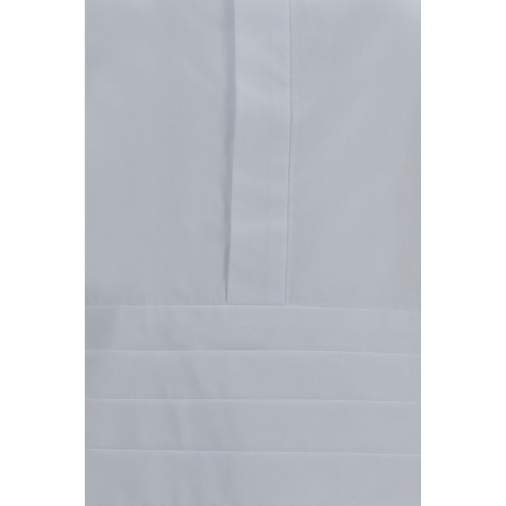 Elevate your wardrobe with the Sacai White Cotton Dress Shirt, a luxurious blend of cotton and polyester, embodying sophistication and innovative design for the modern connoisseur.