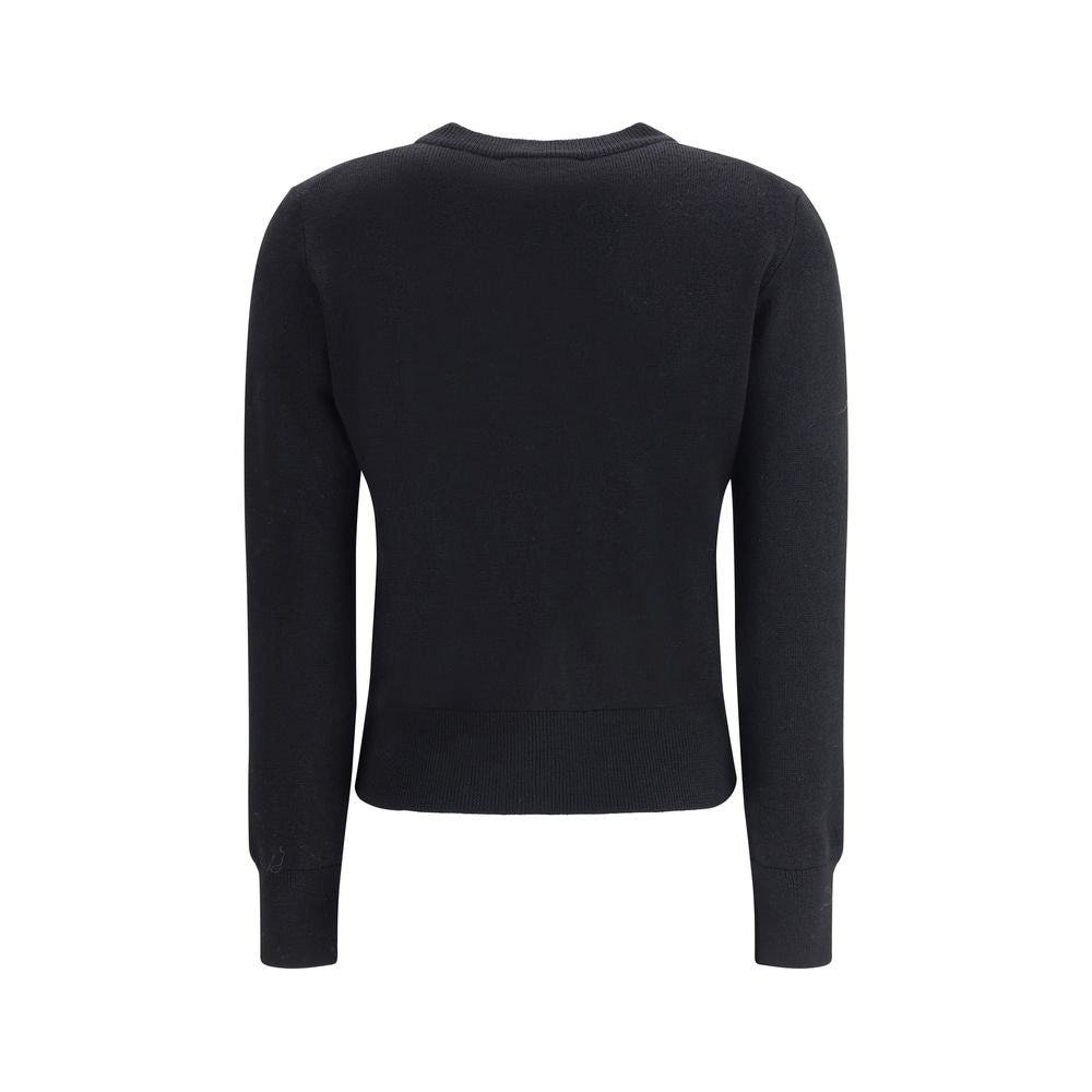 Indulge in the Ami Paris Black Merino Wool Cardigan, a masterpiece of luxury and sophistication, crafted from 100% merino wool for timeless elegance this season.