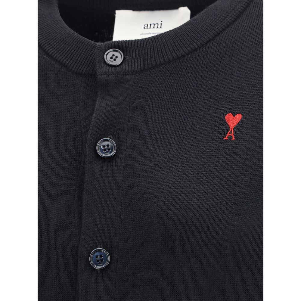 Indulge in the Ami Paris Black Merino Wool Cardigan, a masterpiece of luxury crafted from 100% merino wool, embodying sophistication and timeless elegance for every occasion.