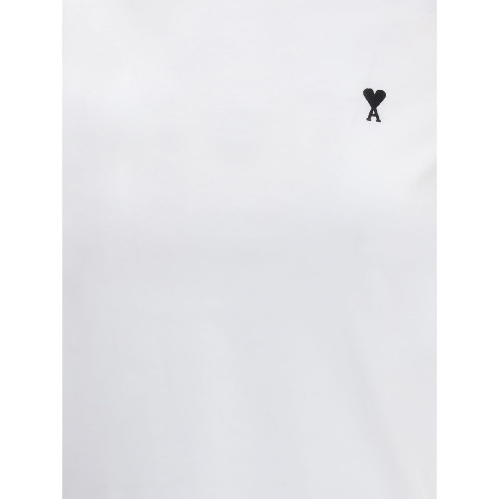 Discover the Ami Paris White Cotton T-Shirt, a seamless blend of elegance and comfort, featuring an iconic embroidered logo for the discerning fashion connoisseur.