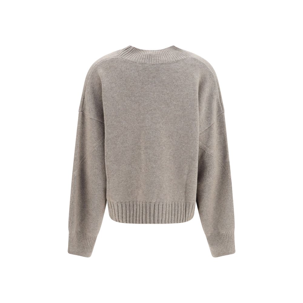 Indulge in the Malo Beige Cashmere Sweater, a masterpiece of 100% cashmere that embodies Italian elegance, perfect for the discerning individual who values luxury and sophistication.