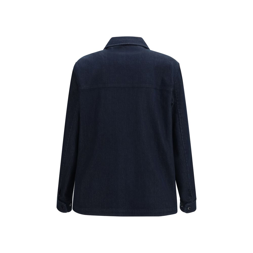 Discover the Moncler Blue Cotton Denim Jacket, a masterpiece of craftsmanship blending luxury and comfort, perfect for the modern connoisseur of style.