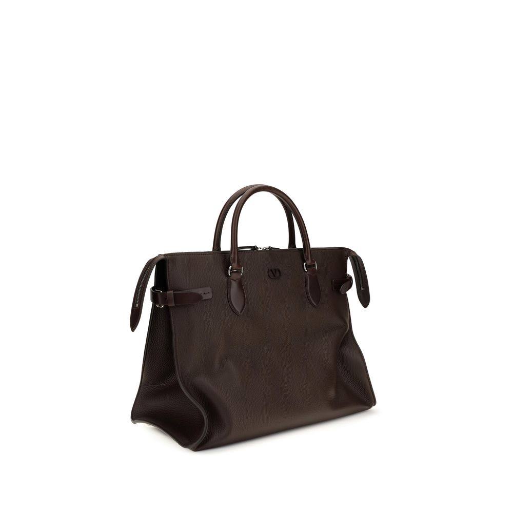 Experience the exquisite Valentino Garavani Brown Calf Leather Bos Taurus Shoulder Bag, a masterpiece of Italian craftsmanship that embodies elegance and versatility for the discerning individual.