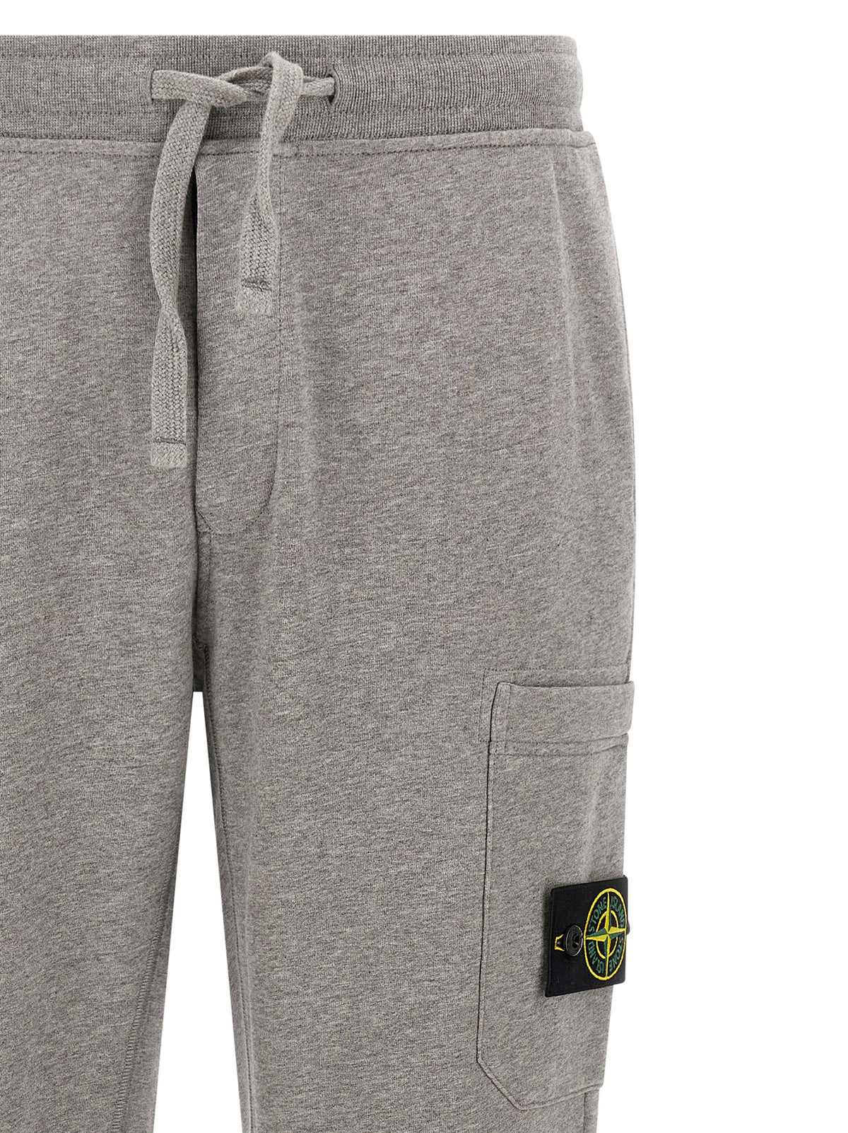 Elevate your wardrobe with Stone Island Gray Cotton Joggers, where luxury craftsmanship meets urban sophistication, perfect for the discerning individual.