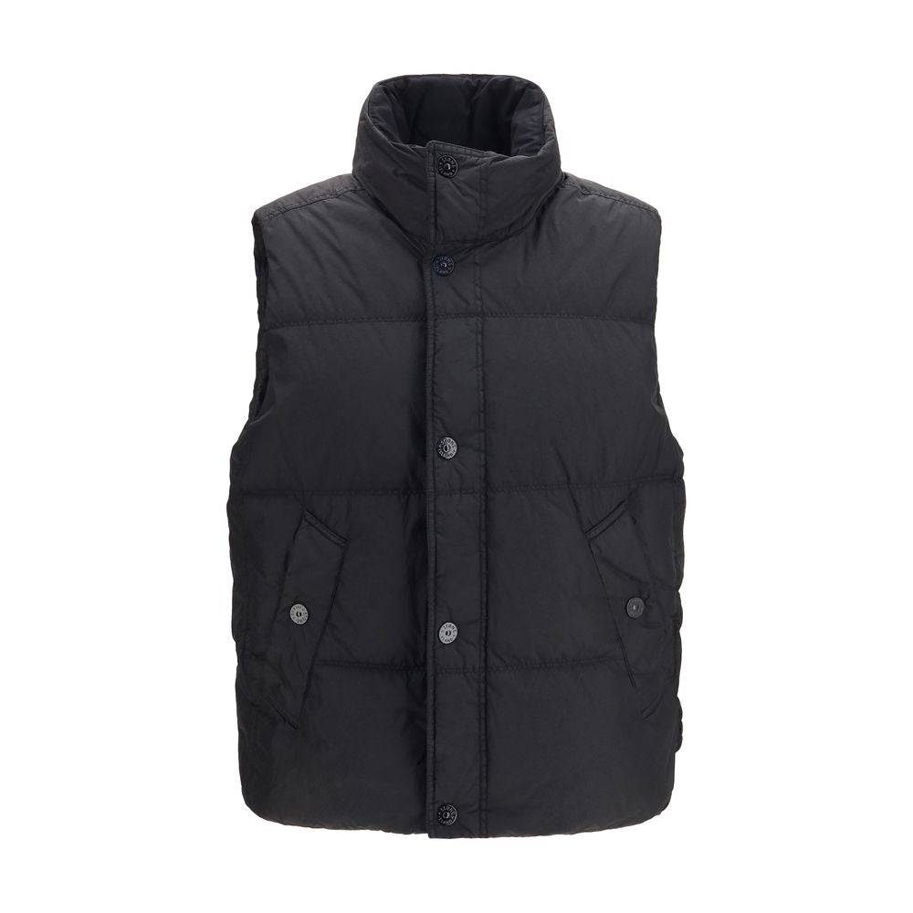 Discover the Stone Island Black Goose Down Sleeveless Jacket, a blend of technical mastery and elegance, crafted from recycled nylon for the discerning individual.
