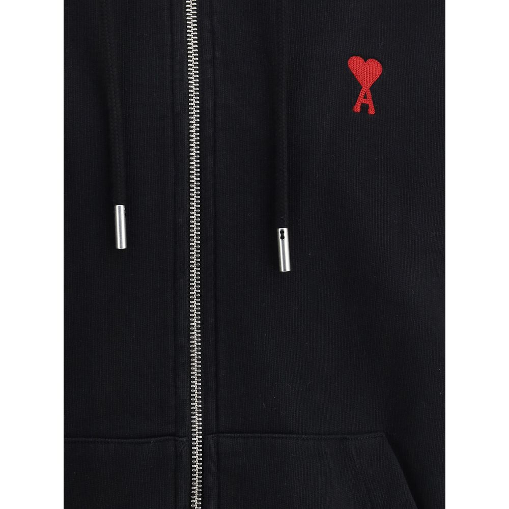 Indulge in the sophistication of the Ami Paris Black Cotton Sweatshirt, a blend of comfort and style, perfect for elevating your casual wardrobe with timeless elegance.