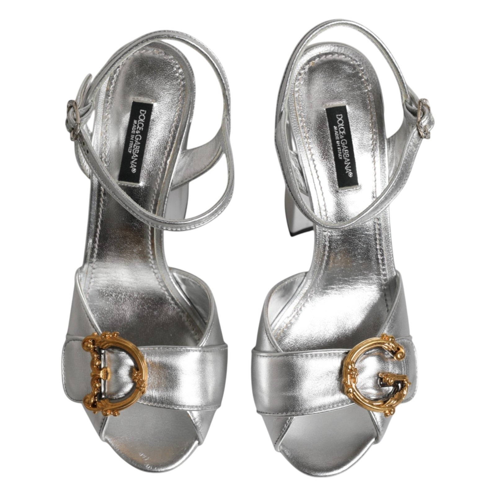Step into elegance with Dolce & Gabbana Silver Logo Ankle Strap Heels, crafted from premium leather, embodying luxury and sophistication for every occasion.
