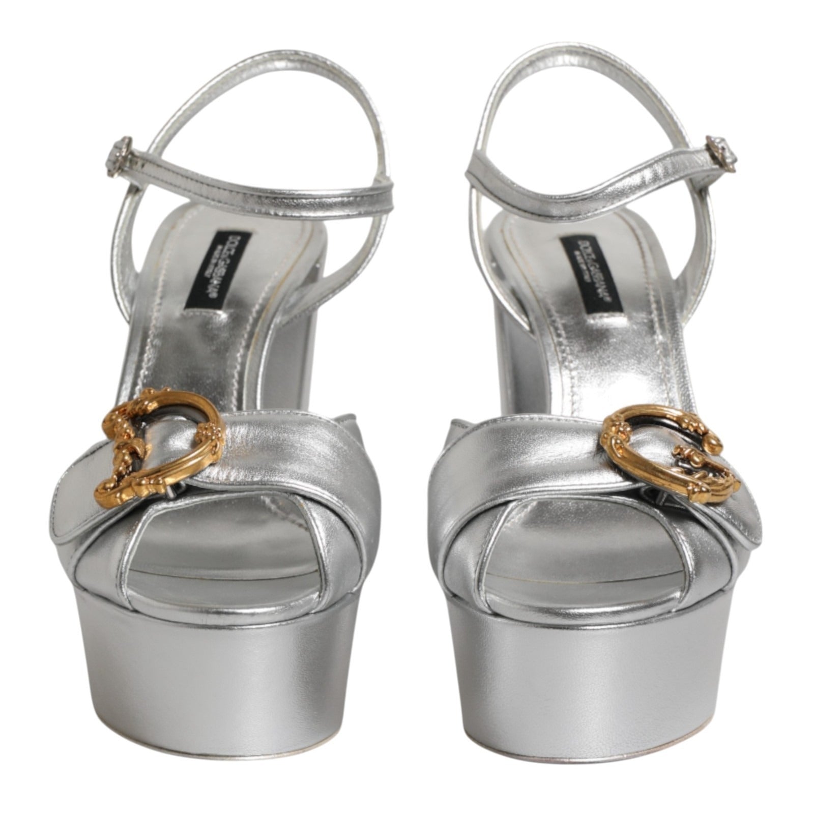 Step into elegance with Dolce & Gabbana Silver Logo Ankle Strap Heels, crafted from luxurious leather, embodying sophistication for every occasion.