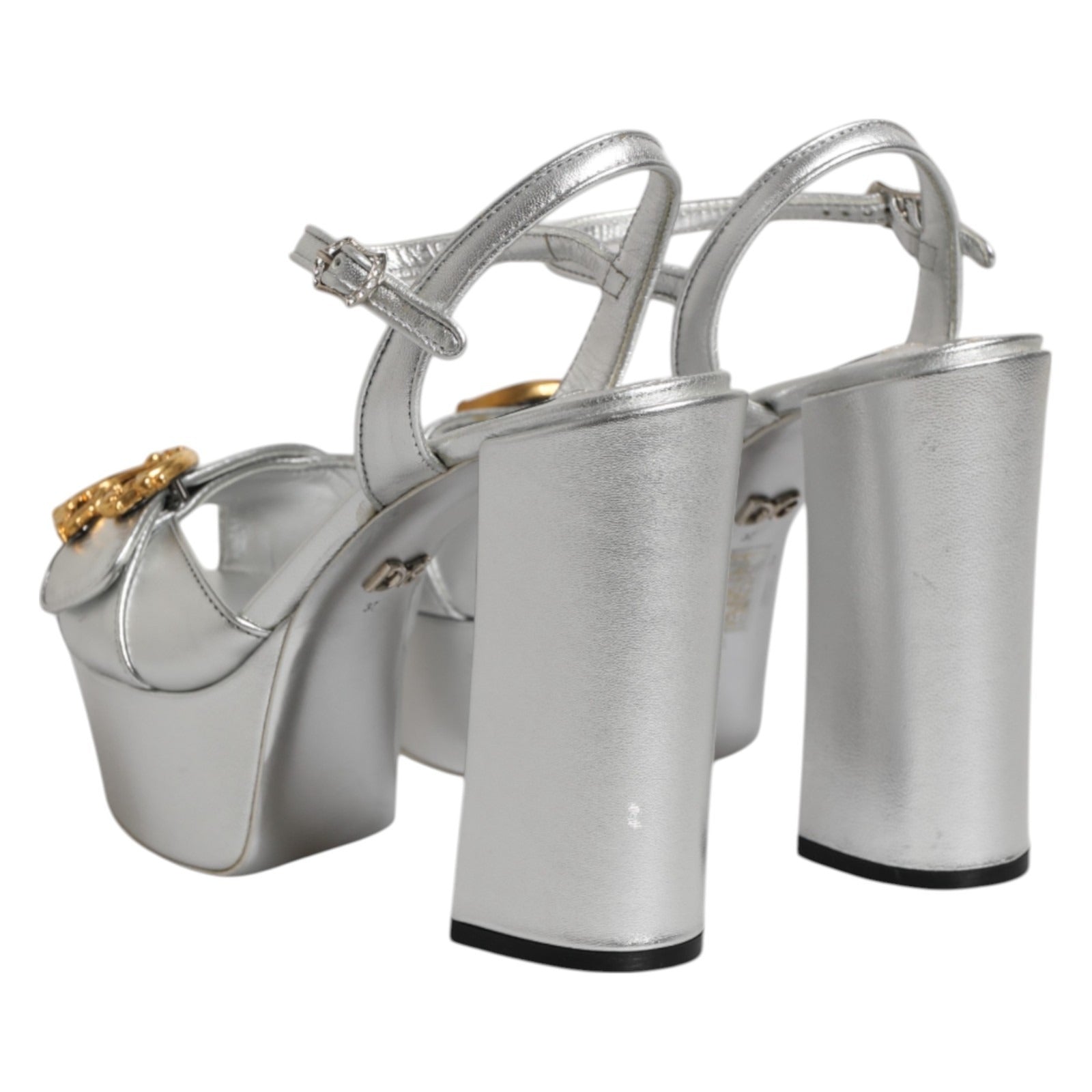 Step into opulence with Dolce & Gabbana's Silver Logo Ankle Strap Heels, crafted from premium leather. Elevate your style with luxurious sophistication and timeless elegance.