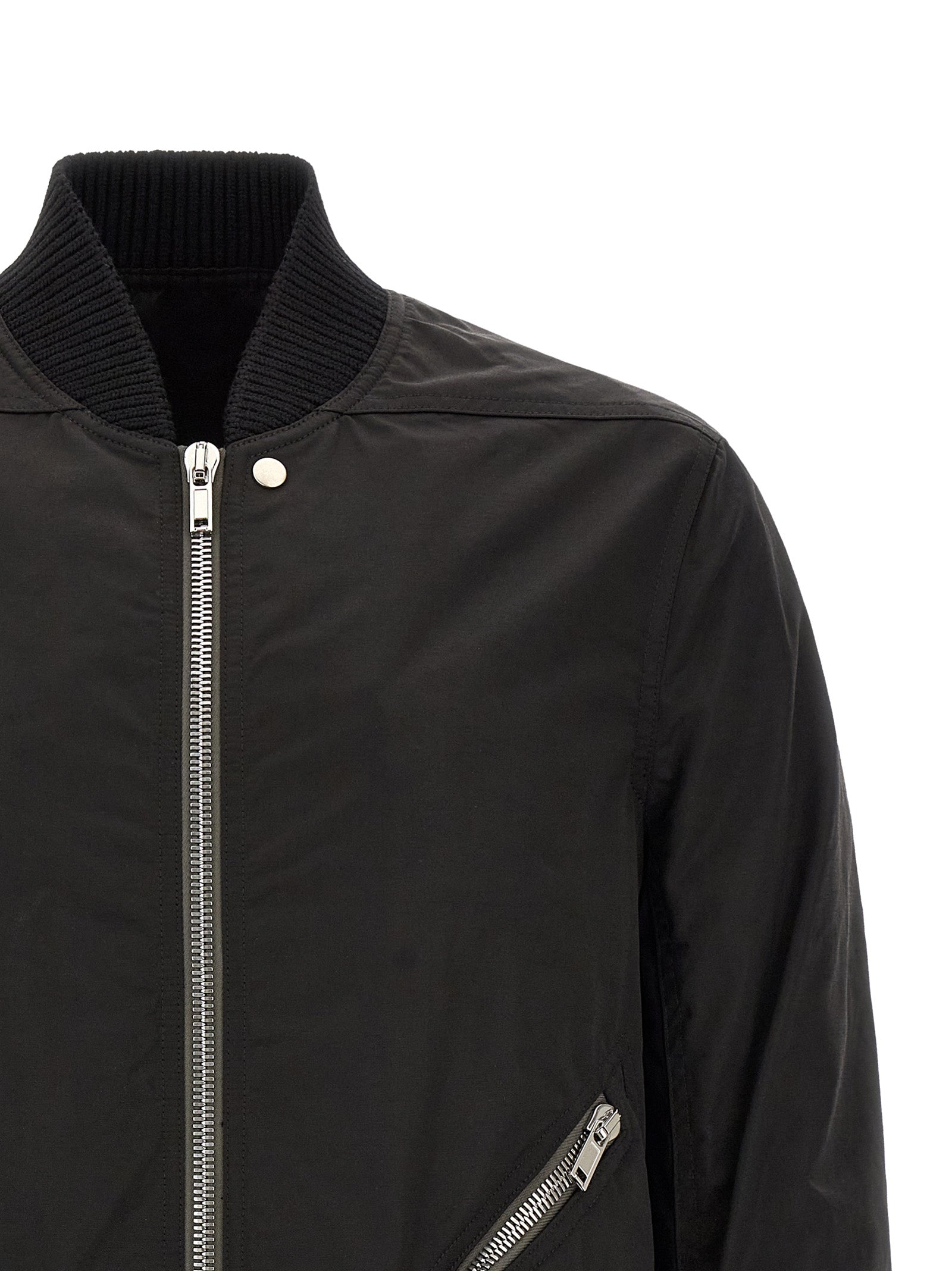 Elevate your style with the Rick Owens Black Nylon Bomber, a masterpiece of Italian craftsmanship that embodies avant-garde luxury and effortless sophistication.