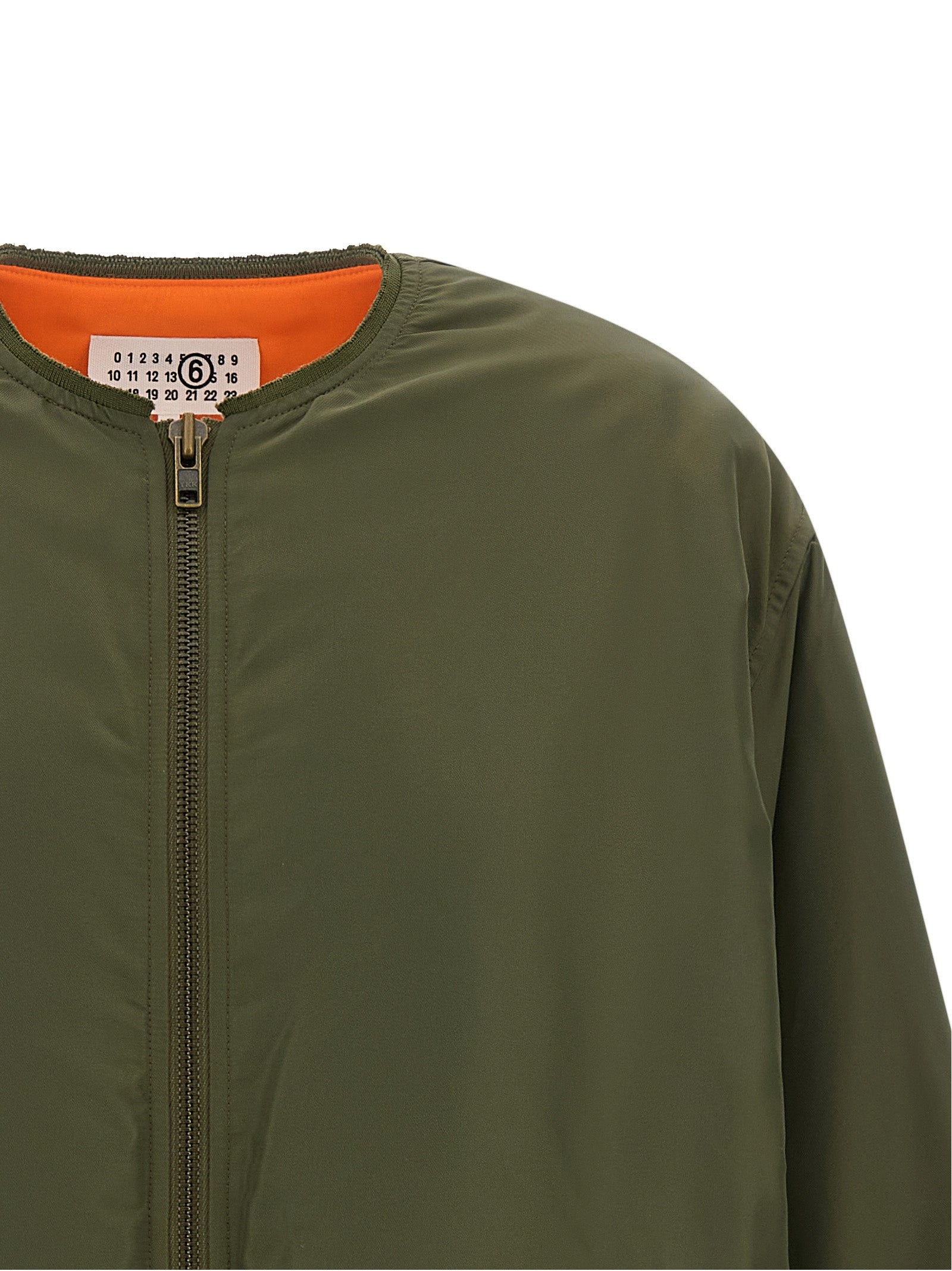 Elevate your outerwear collection with the MM6 Maison Margiela Bicolor Polyamide Bomber, a masterpiece of Italian craftsmanship that redefines luxury and style.