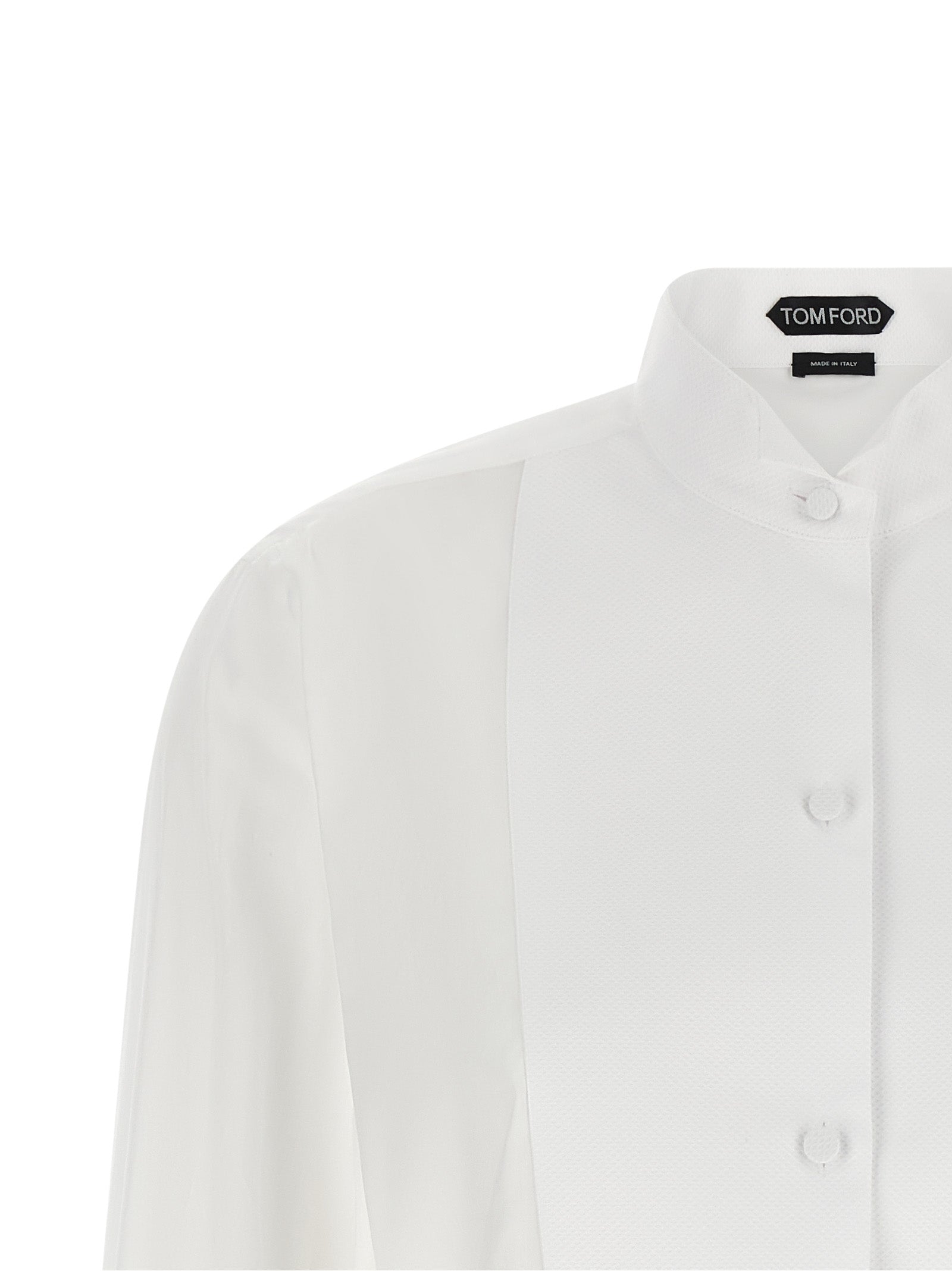 Discover the Tom Ford White Cotton Blouse, a timeless masterpiece of formal tailoring crafted from pure cotton, exuding elegance and sophistication for the discerning individual.