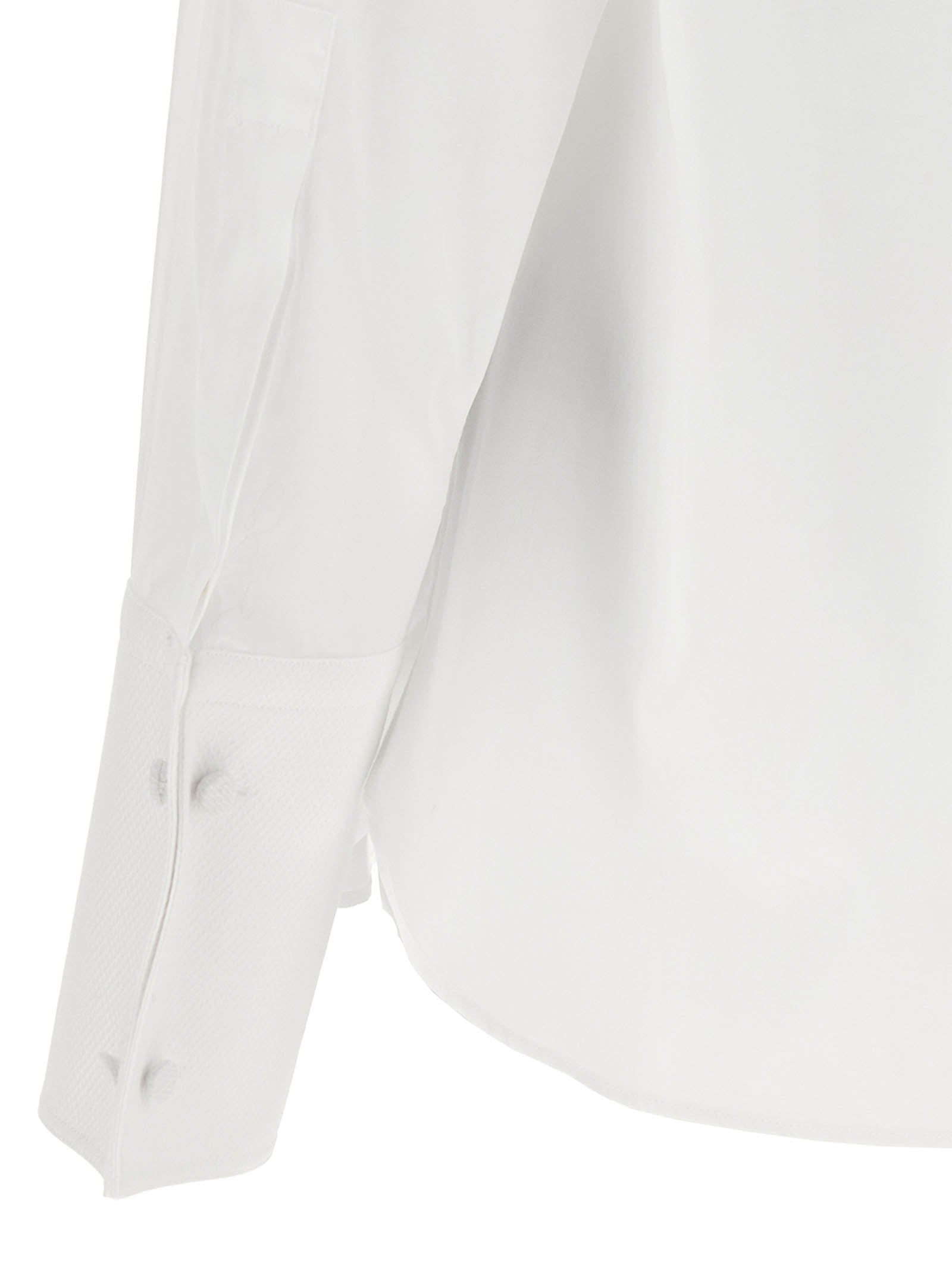 Elevate your wardrobe with the Tom Ford White Cotton Blouse, a masterpiece of formal tailoring crafted from pure cotton, embodying timeless elegance and sophistication.