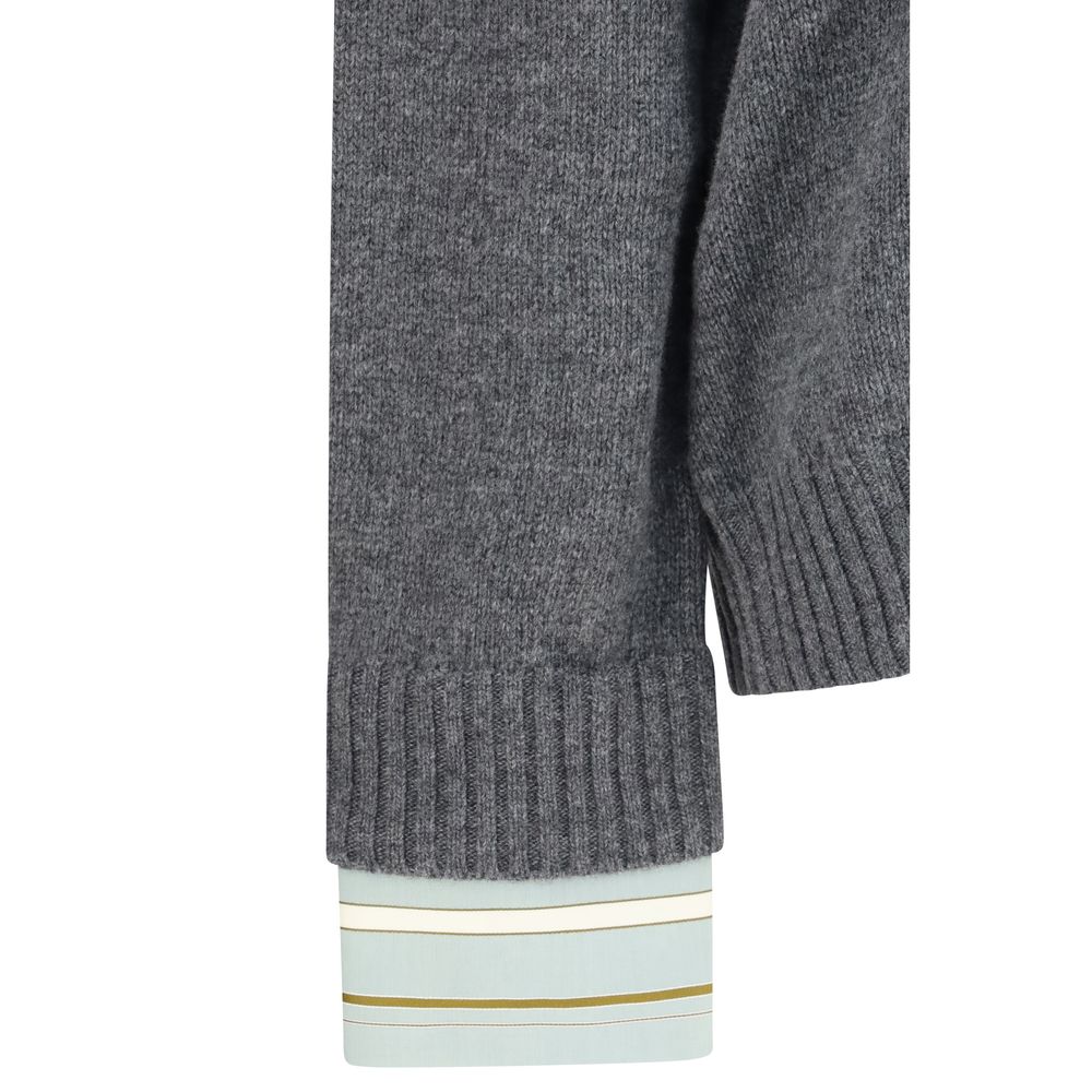 Elevate your wardrobe with the Prada Gray Wool Oves Aries Sweatshirt, a luxurious blend of Fleece Wool and Kashmir, embodying timeless elegance and sophisticated craftsmanship.