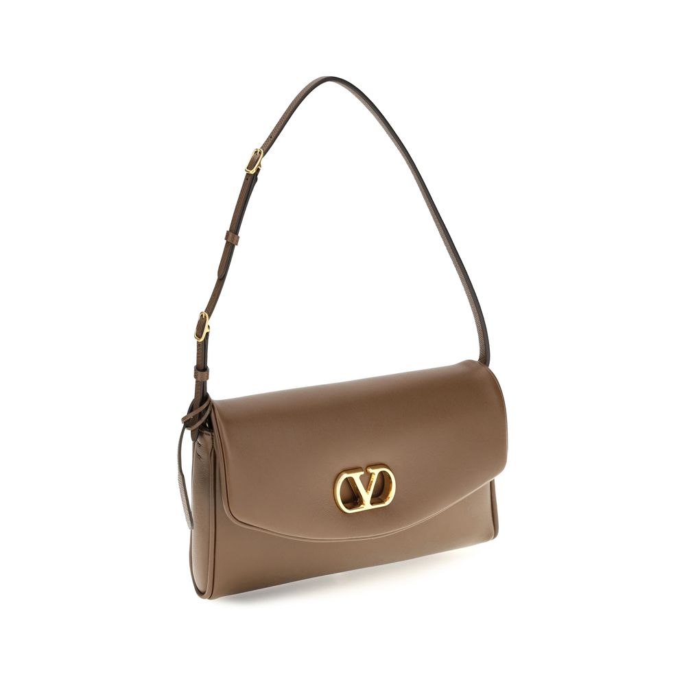 Discover the Valentino Garavani Brown Calf Leather Bos Taurus Shoulder Bag, a masterpiece of nappa leather and exquisite craftsmanship, embodying timeless elegance and refined luxury.