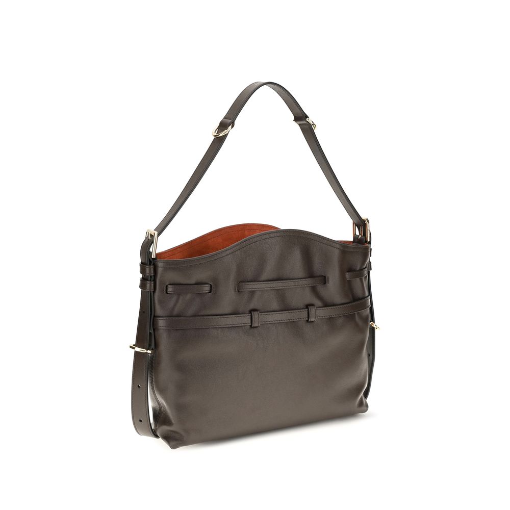Discover the Givenchy Brown Calf Leather Bos Taurus Bucket Bag, a luxurious blend of smooth calfskin and sophisticated design, perfect for the discerning individual.