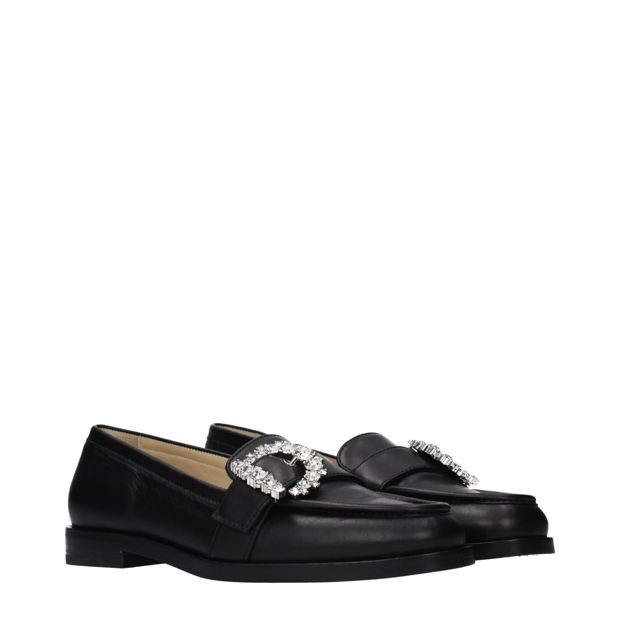 Indulge in the sophistication of Jimmy Choo's Black Leather Slip-On Loafers, where exquisite craftsmanship meets timeless elegance, perfect for the discerning connoisseur.
