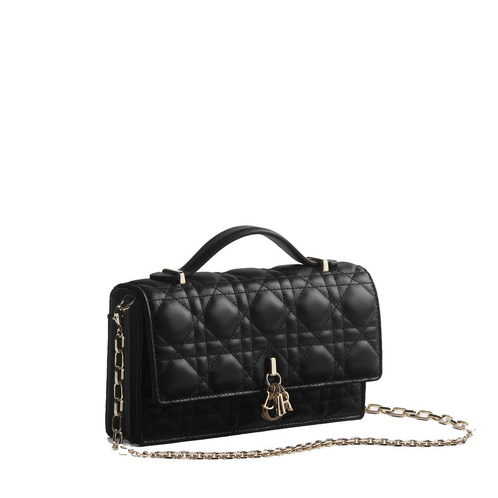 Indulge in the exquisite Dior Black Leather Shoulder Bag, crafted from luxurious quilted lambskin, adorned with gold-tone charms—an emblem of timeless elegance and sophistication.