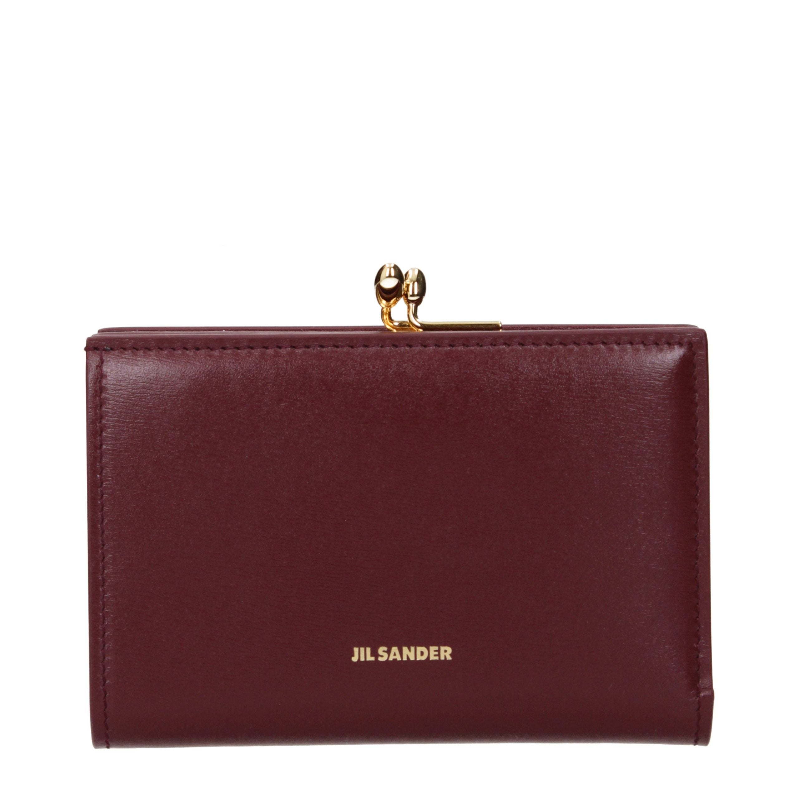 Experience the allure of the Jil Sander Red Leather Wallet, a testament to exquisite craftsmanship and timeless elegance, perfect for those who embody luxury and sophistication.