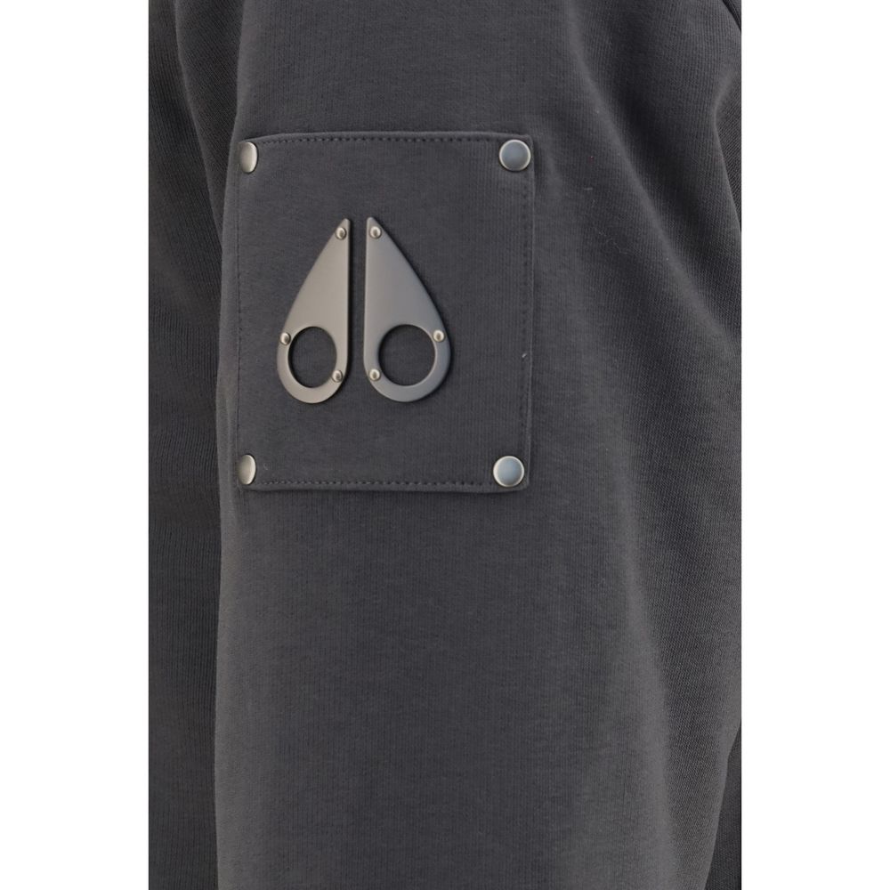 Elevate your wardrobe with the Moose Knuckles Bunny Hooded Sweatshirt, a blend of comfort and sophistication crafted for colder days, featuring luxurious removable fur lining.
