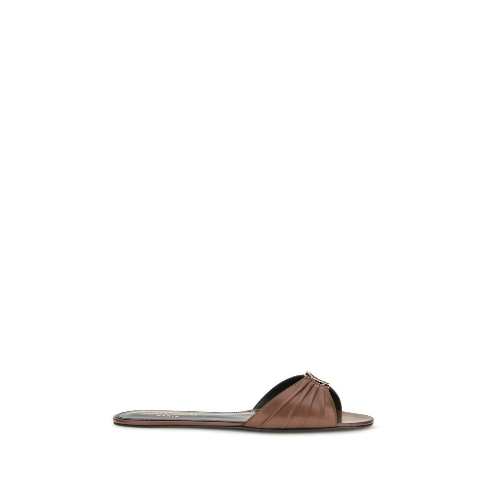 Indulge in the exquisite Saint Laurent Brown Calf Leather Bos Taurus Mules, where luxurious craftsmanship meets timeless elegance, perfect for any discerning wardrobe.